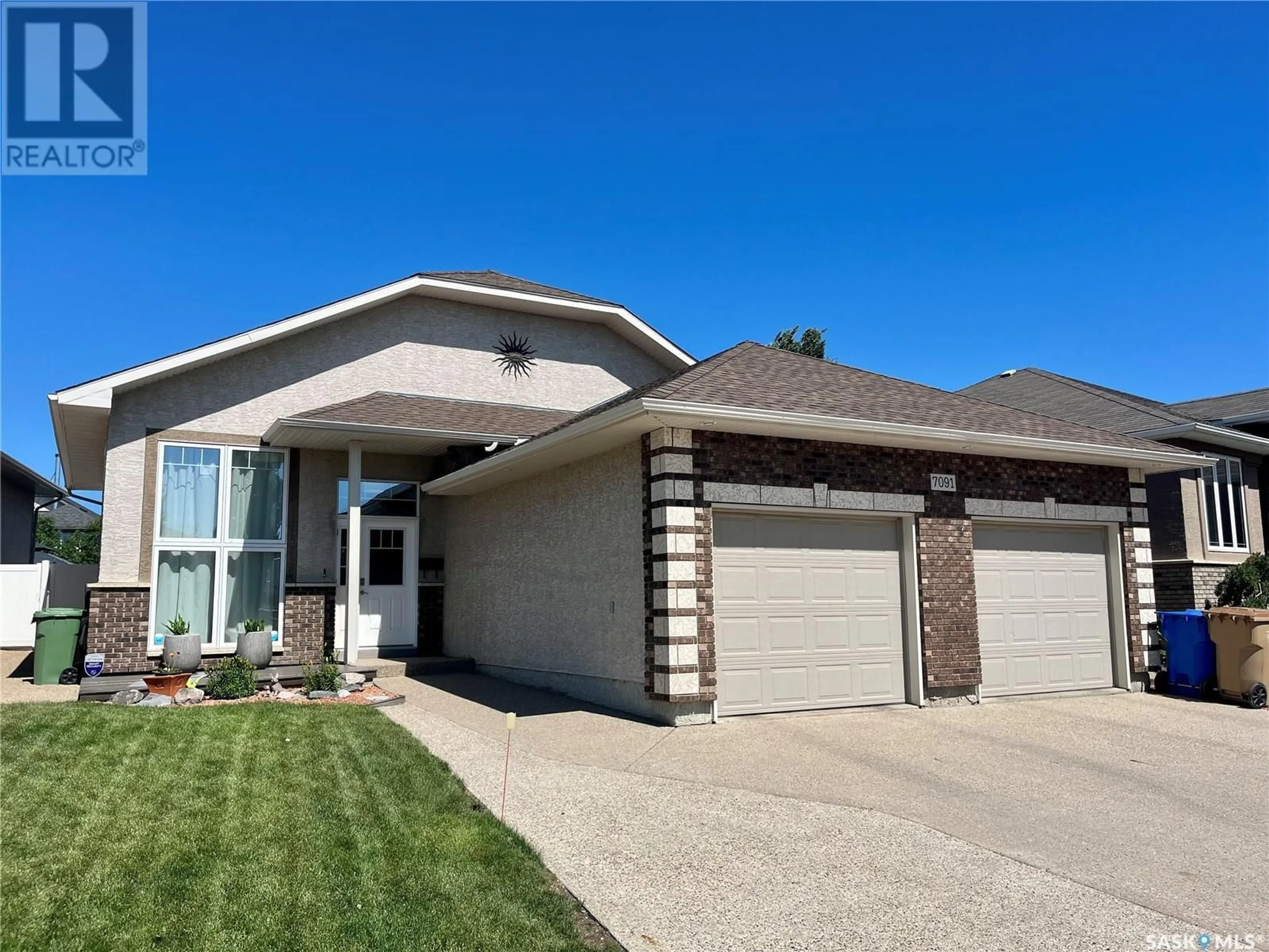 Home with brick exterior material, street for 7091 MAPLE RIDGE DRIVE, Regina Saskatchewan S4X0B2