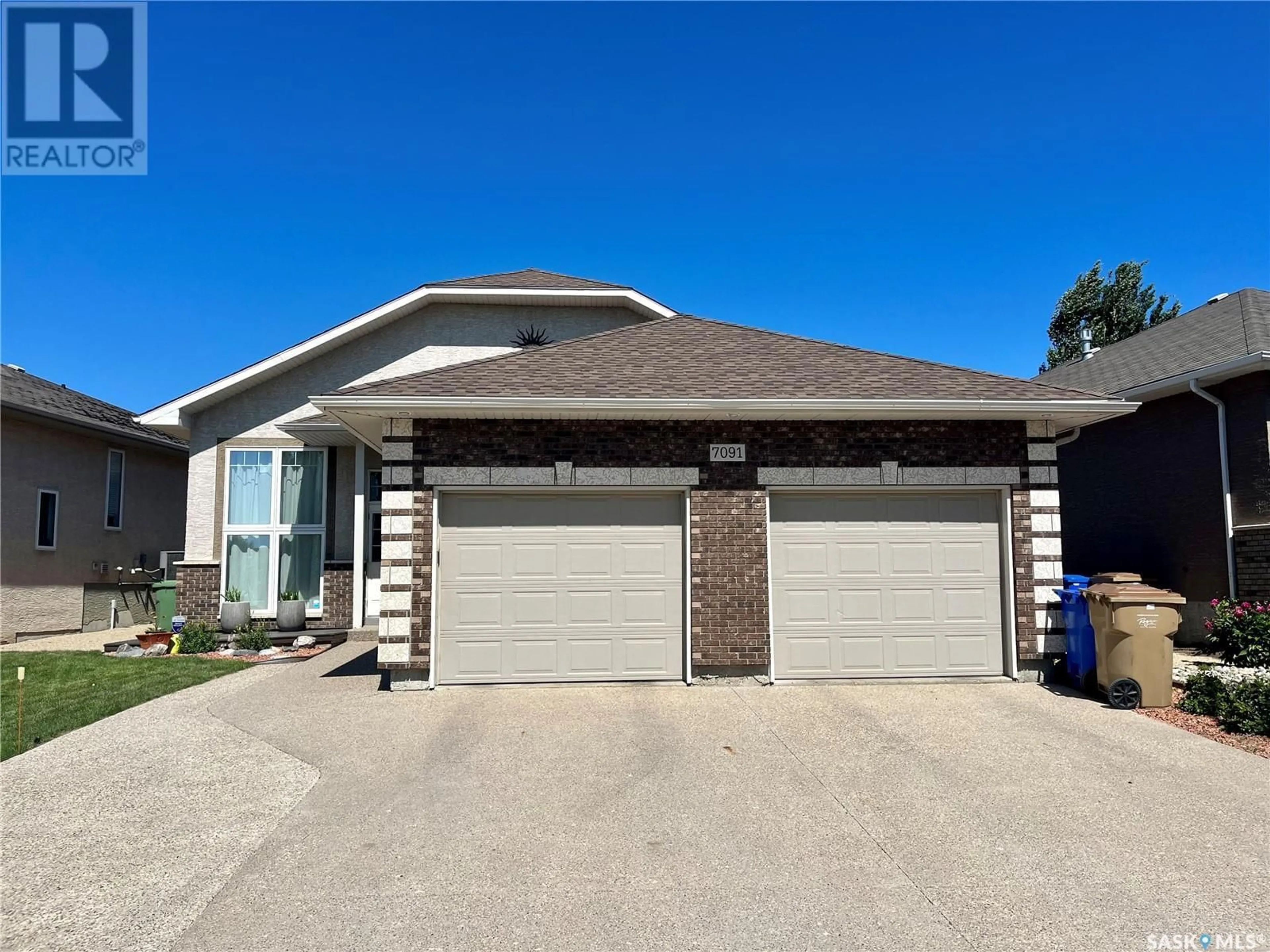 Home with brick exterior material, street for 7091 MAPLE RIDGE DRIVE, Regina Saskatchewan S4X0B2