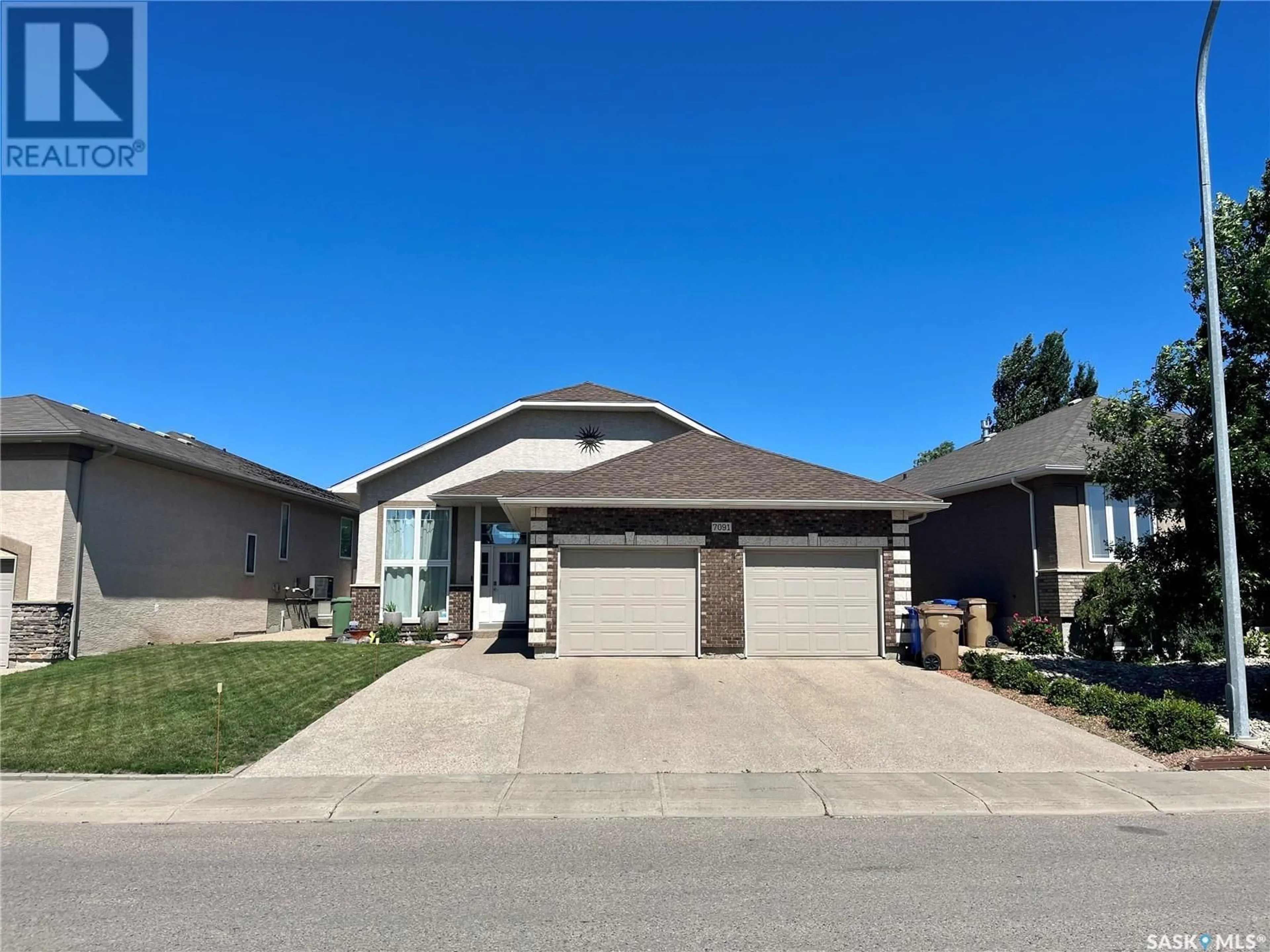 Home with brick exterior material, street for 7091 MAPLE RIDGE DRIVE, Regina Saskatchewan S4X0B2