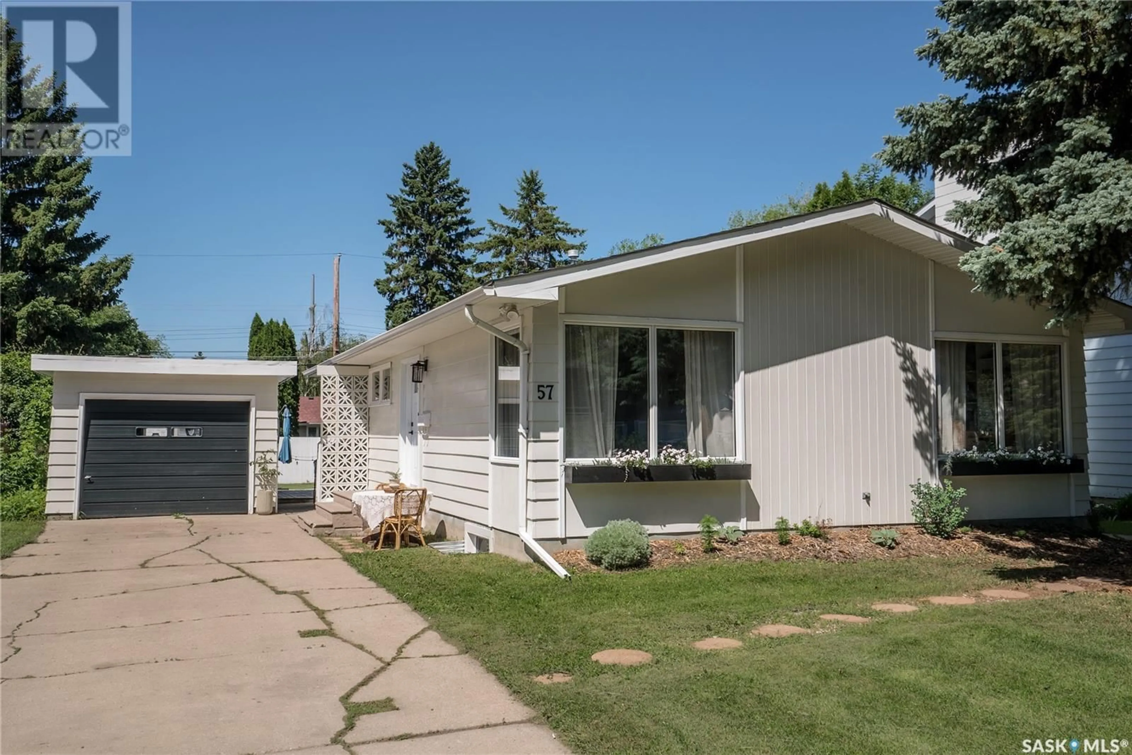 Home with vinyl exterior material, street for 57 KIRK CRESCENT, Saskatoon Saskatchewan S7H3B1