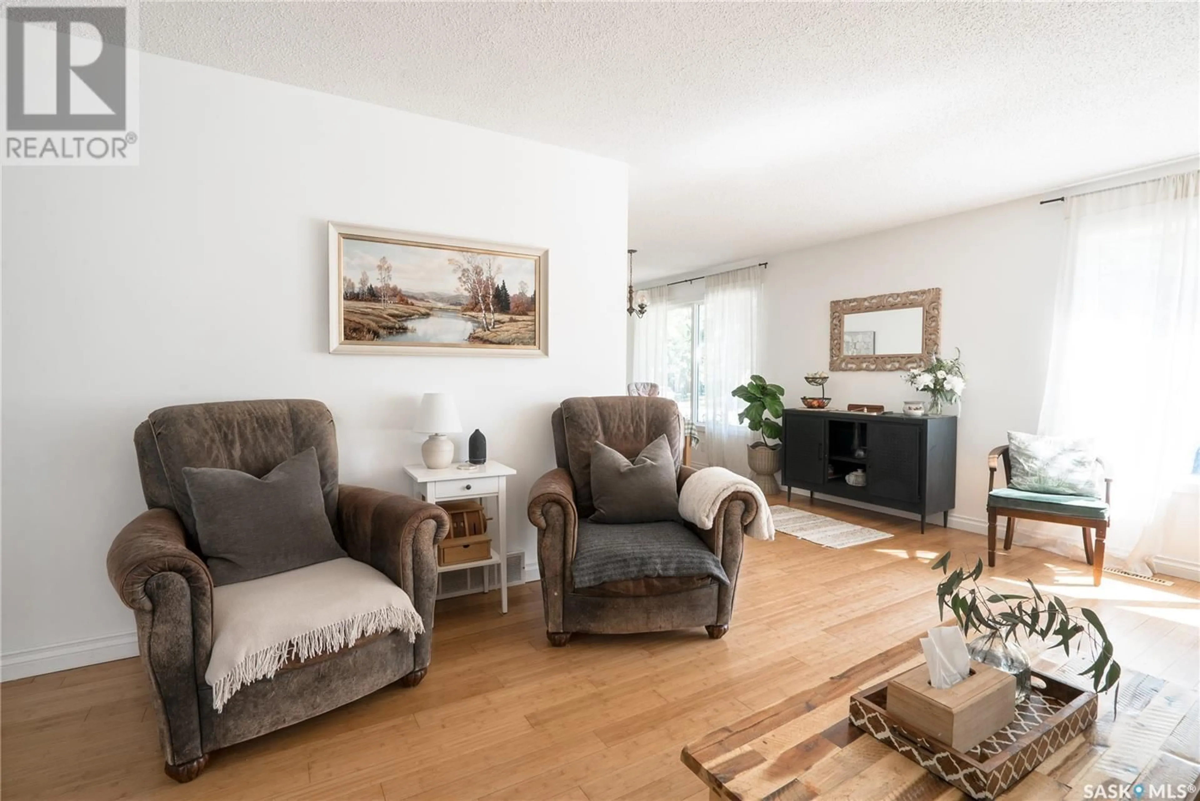 Living room with furniture, wood/laminate floor for 57 KIRK CRESCENT, Saskatoon Saskatchewan S7H3B1