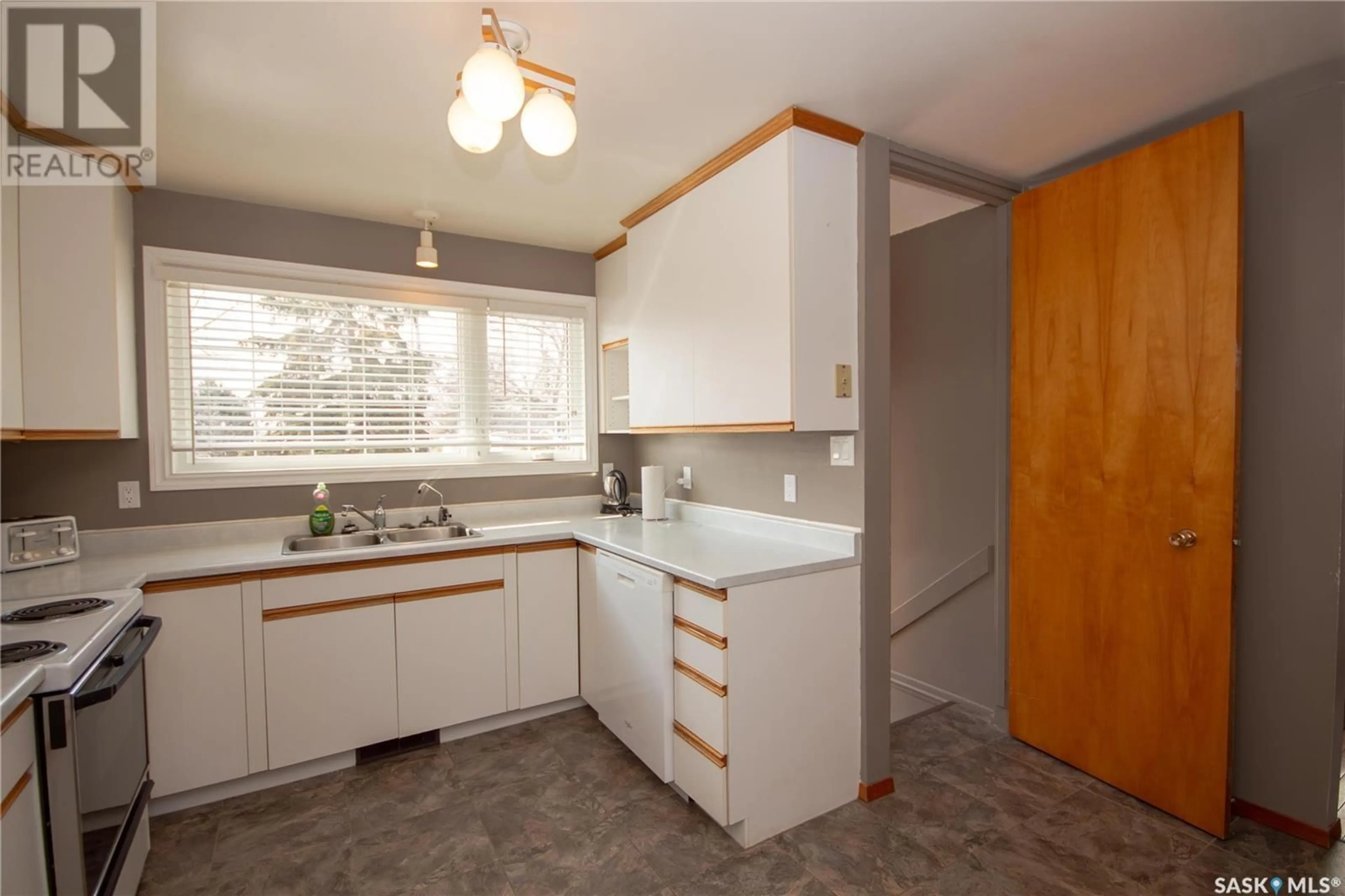 Standard kitchen, wood/laminate floor for 8920 17TH AVENUE, North Battleford Saskatchewan S9A2T9