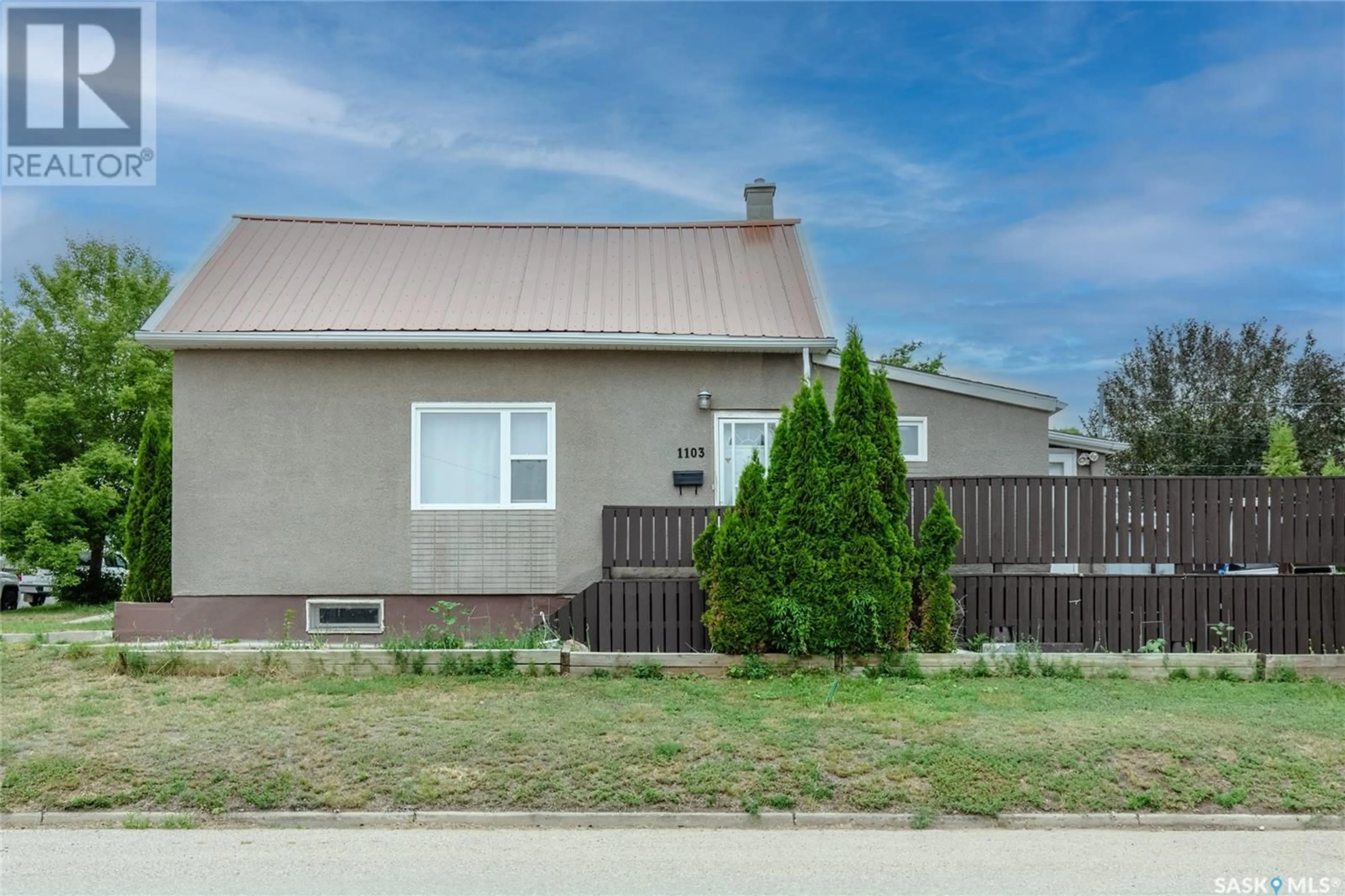Home with vinyl exterior material, street for 1103 4TH AVENUE NE, Moose Jaw Saskatchewan S6H1H9