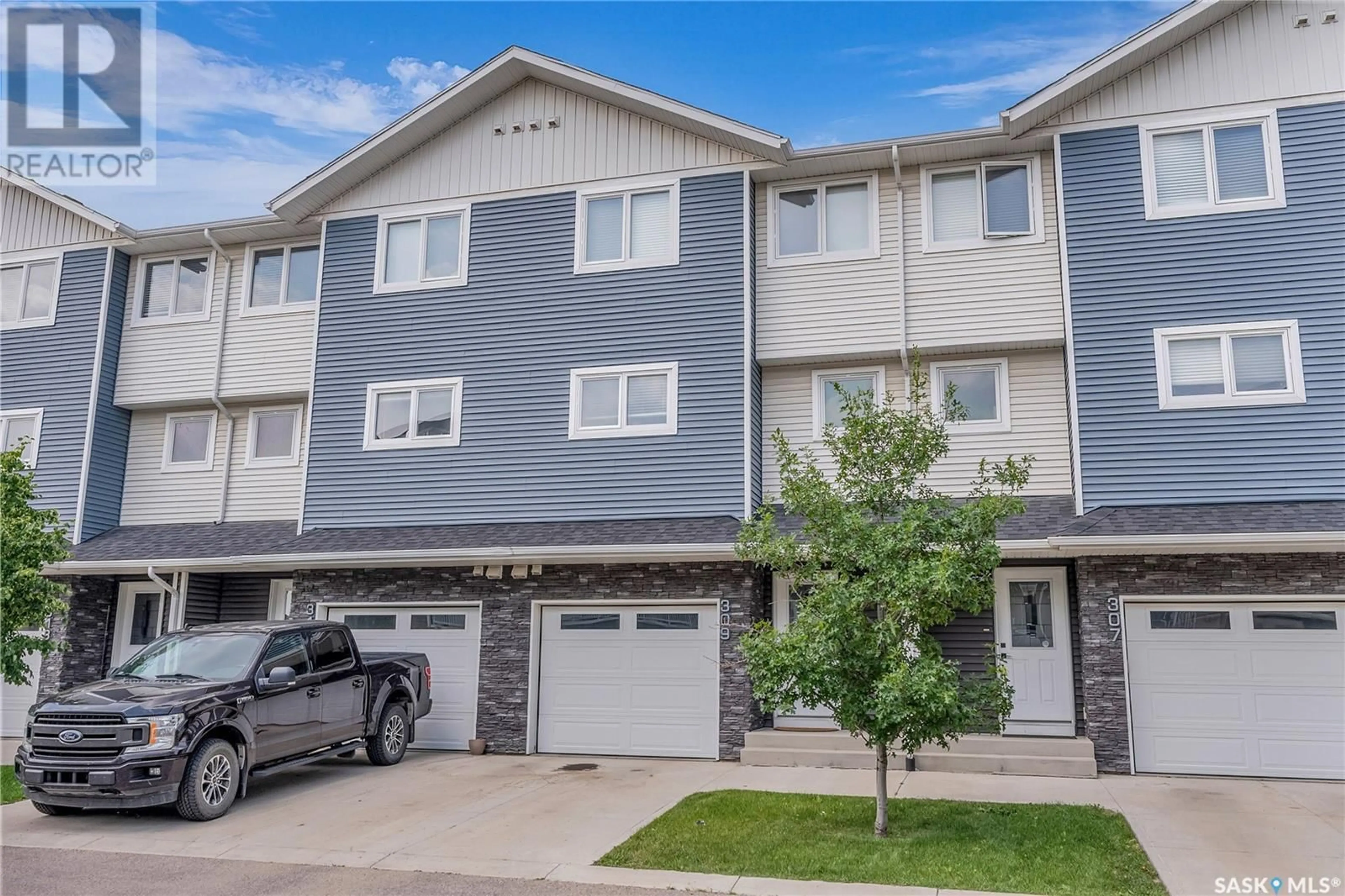 Home with vinyl exterior material, street for 309 315 KLOPPENBURG LINK, Saskatoon Saskatchewan S7W0V9