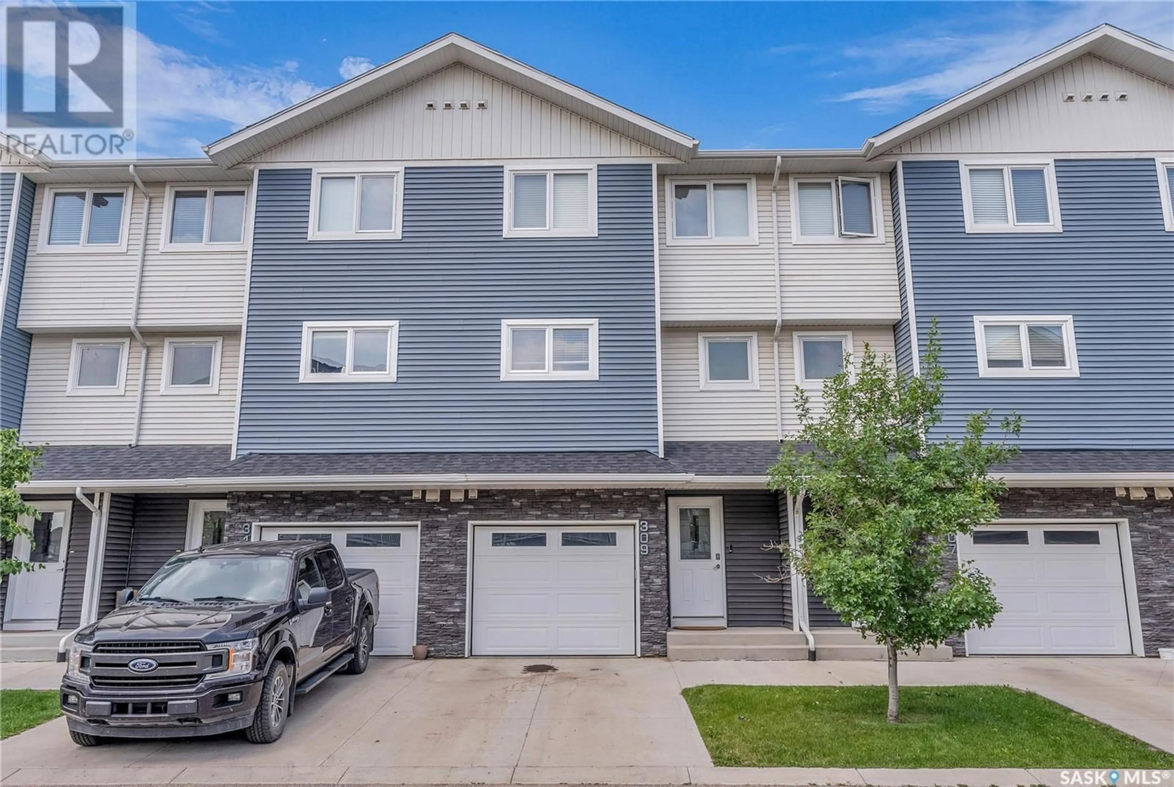 Home with vinyl exterior material, street for 309 315 KLOPPENBURG LINK, Saskatoon Saskatchewan S7W0V9