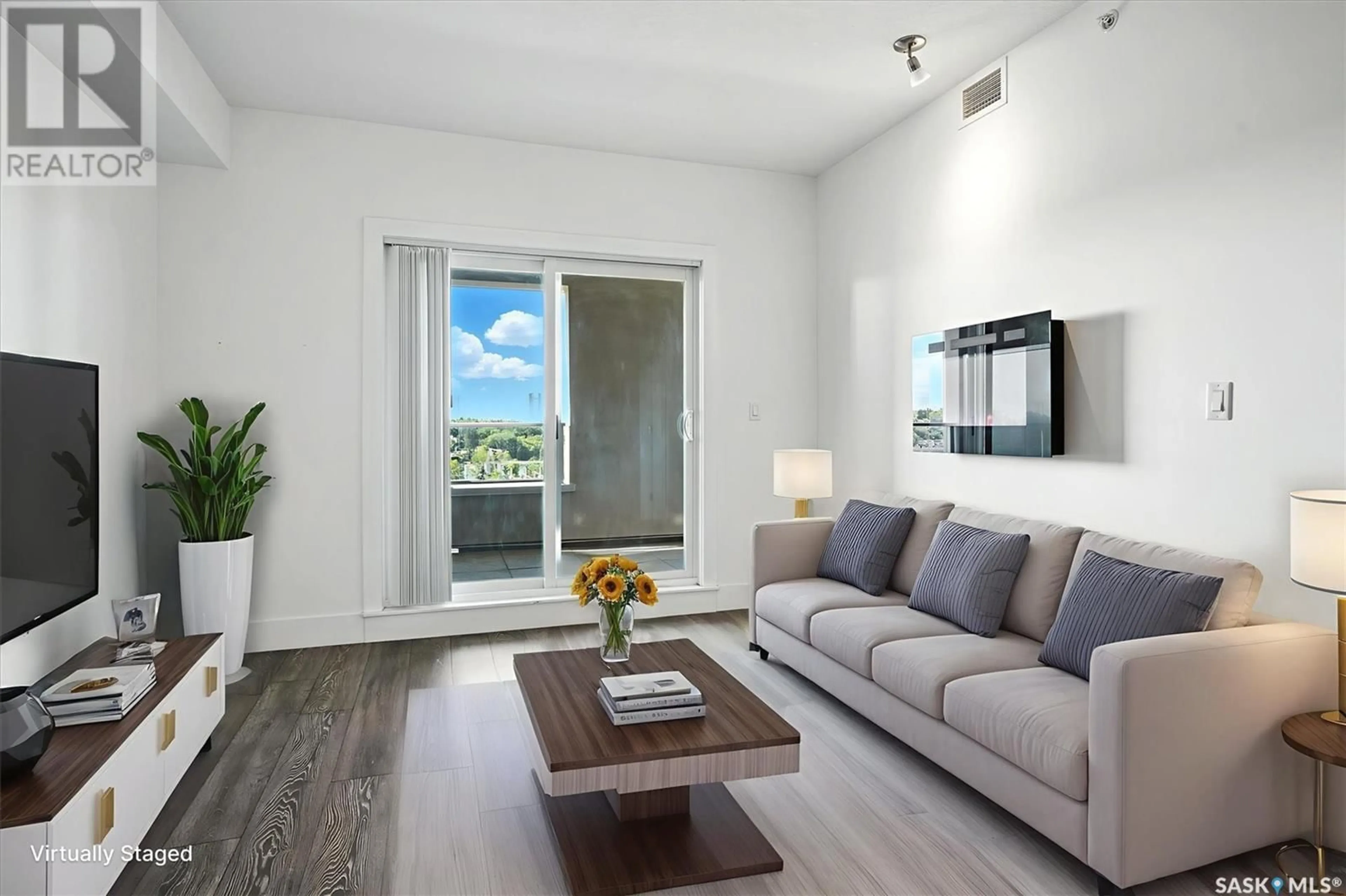 Living room with furniture, wood/laminate floor for 409 - 401 B AVENUE S, Saskatoon Saskatchewan S7M5M8