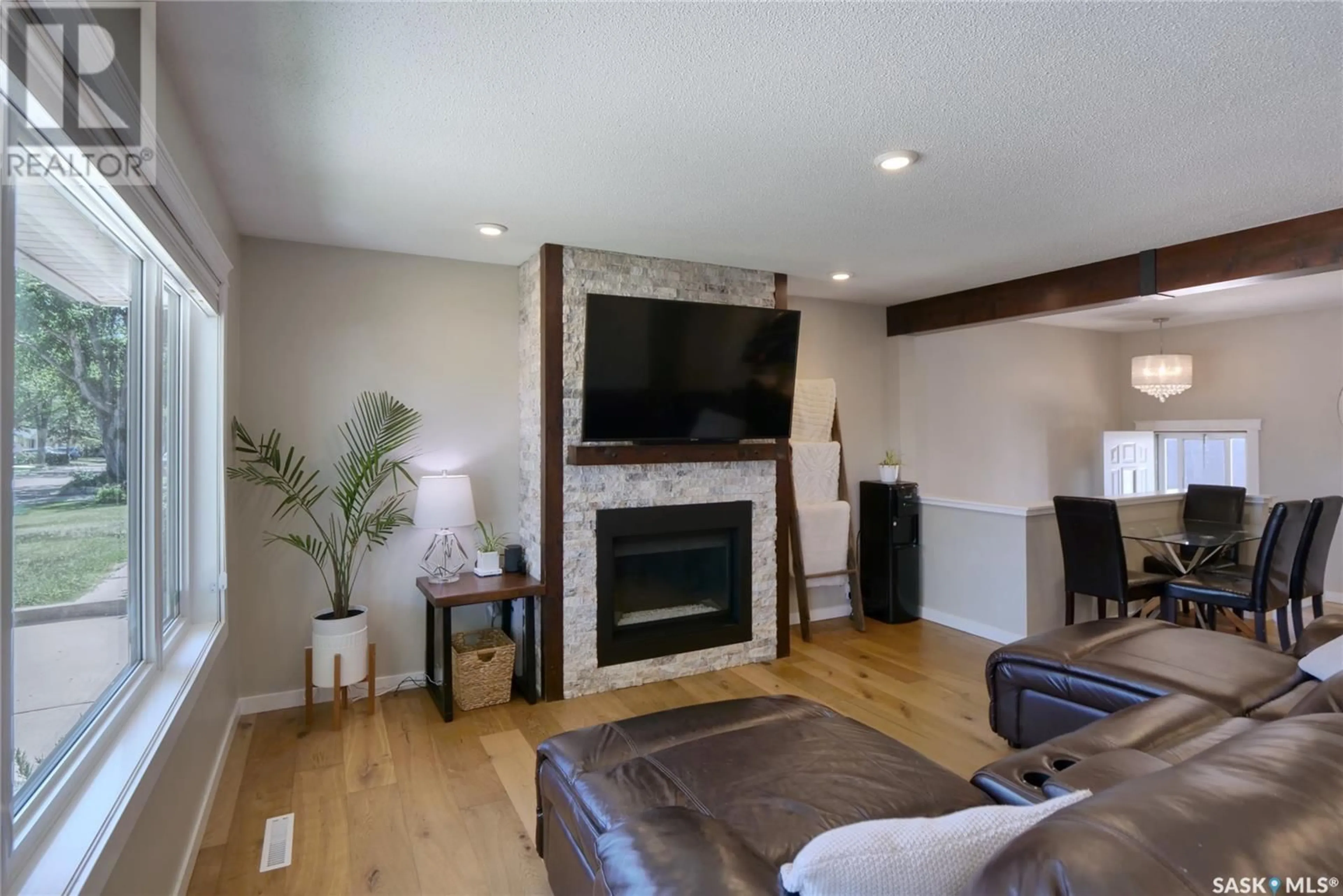 Living room with furniture, wood/laminate floor for 1050 GRAYSON CRESCENT, Moose Jaw Saskatchewan S6H3G1