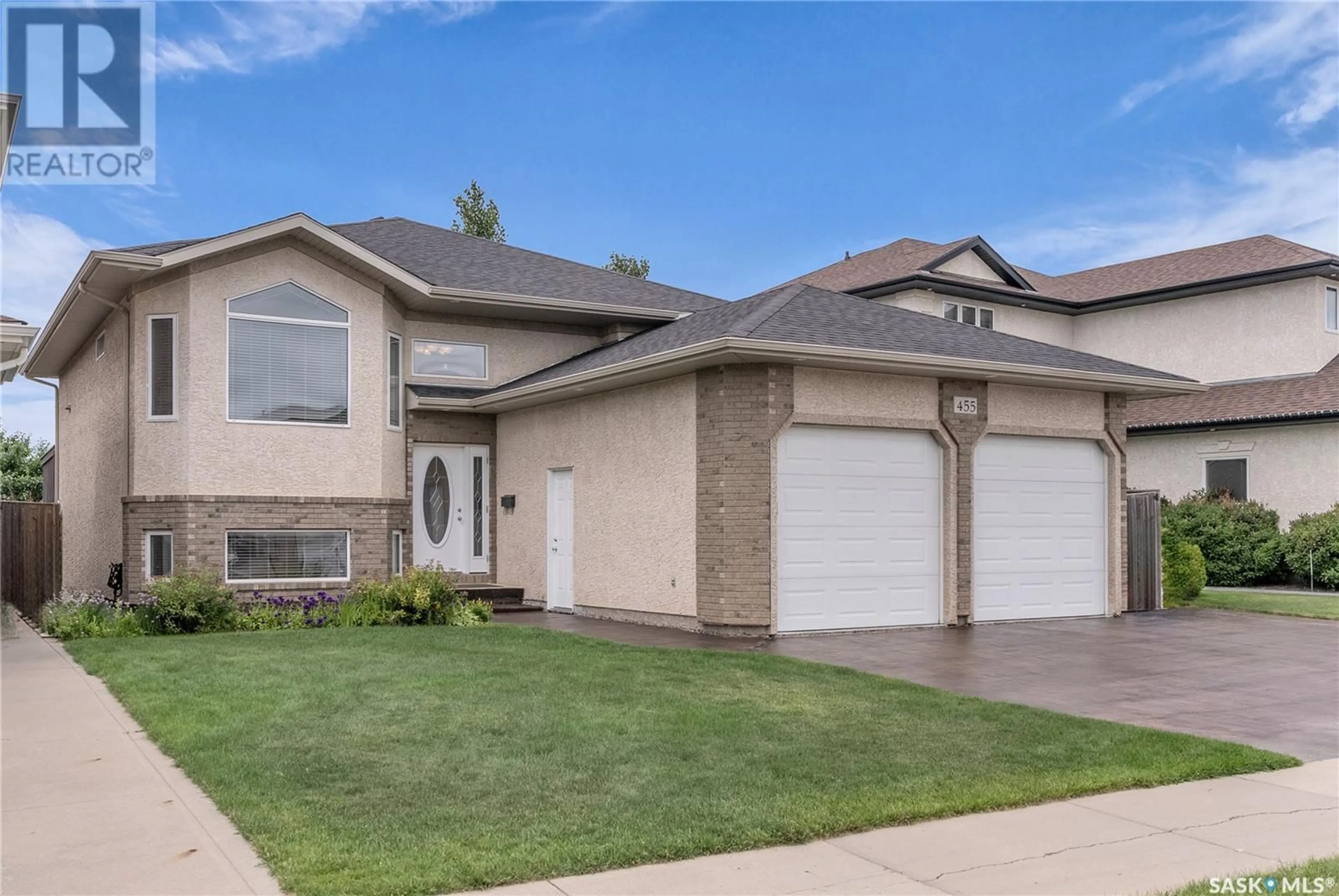 Home with vinyl exterior material, street for 455 STENSRUD ROAD, Saskatoon Saskatchewan S7W1C3