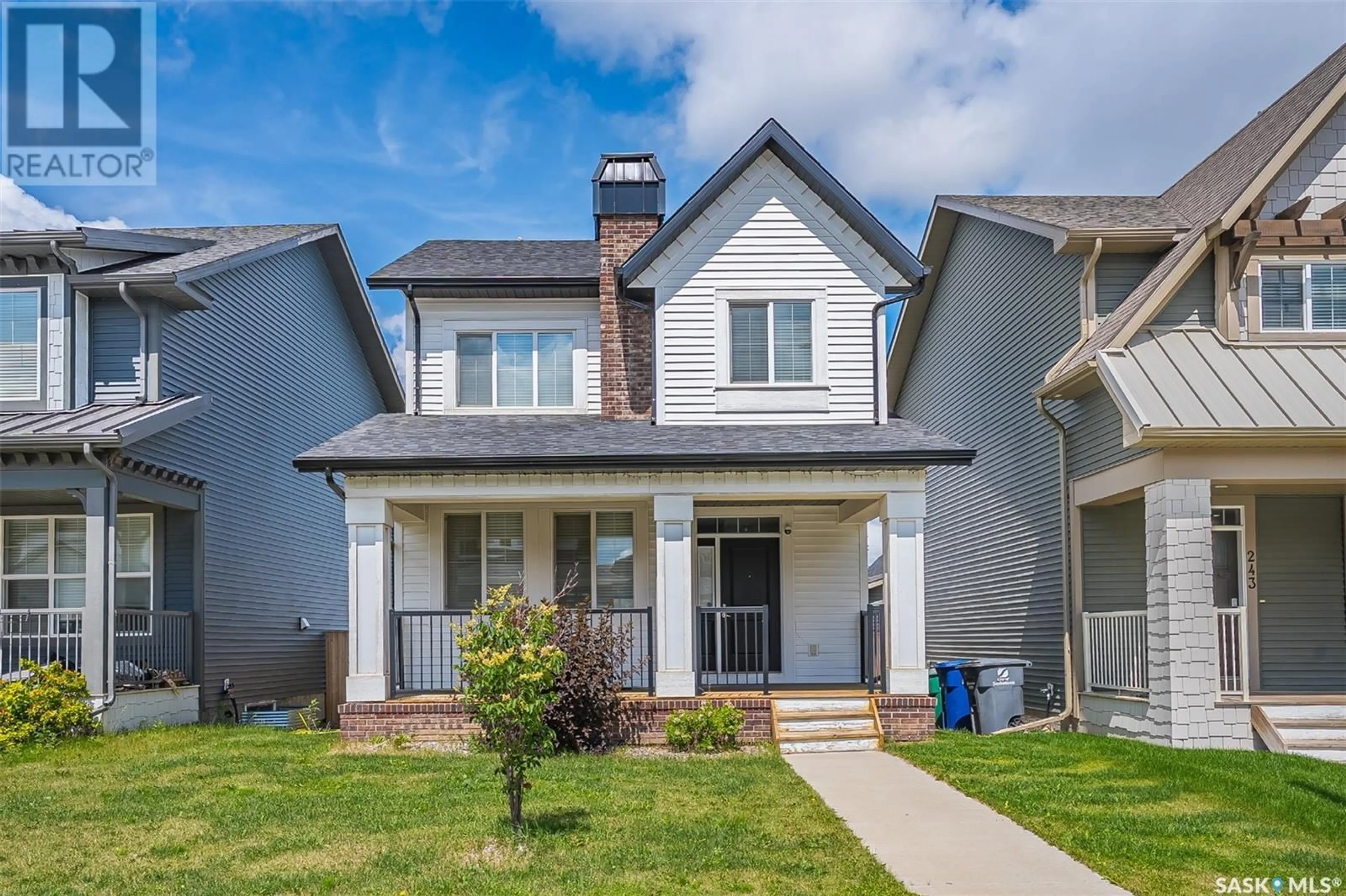 Home with vinyl exterior material, street for 247 NEWTON LINK, Saskatoon Saskatchewan S7V0M8