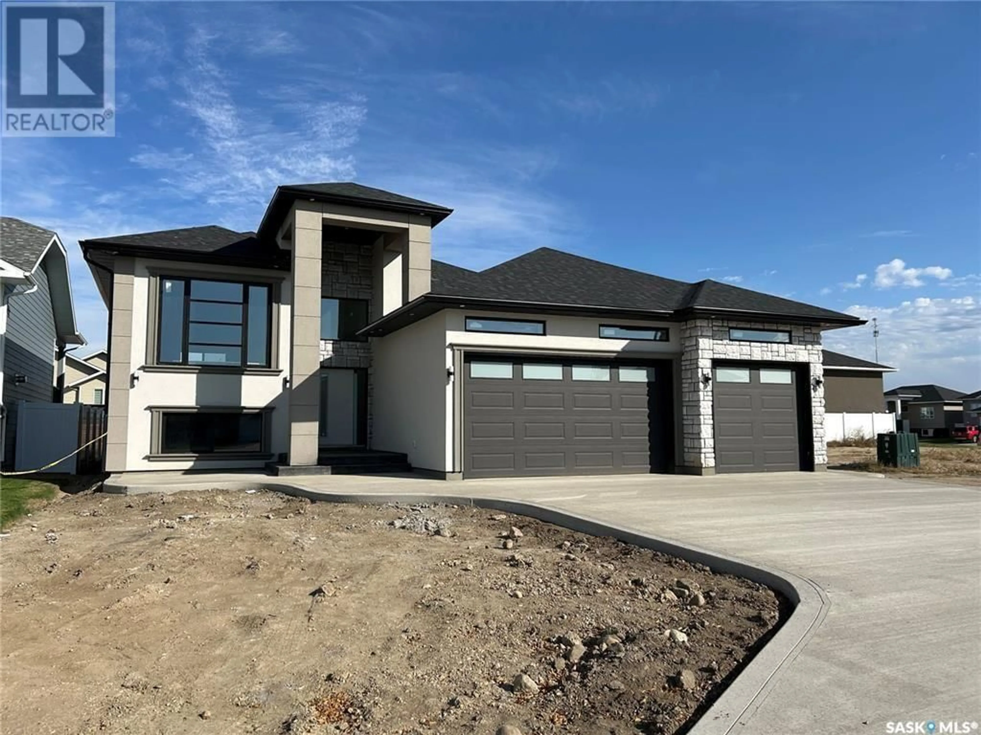 Home with brick exterior material, street for 714 WEIR CRESCENT, Warman Saskatchewan S0K4S4