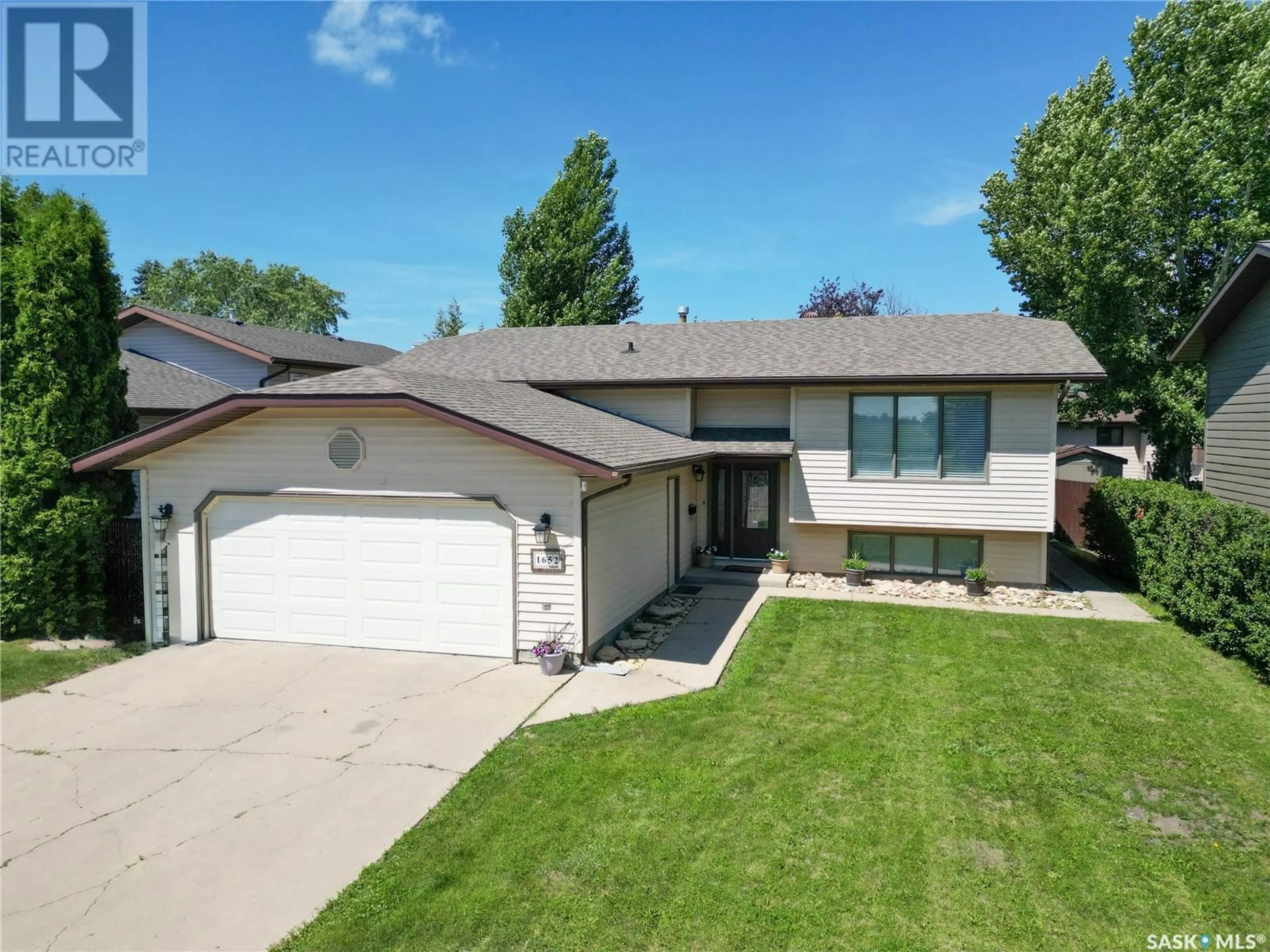 Home with vinyl exterior material, street for 1652 BARTON DRIVE, Prince Albert Saskatchewan S6V7T1
