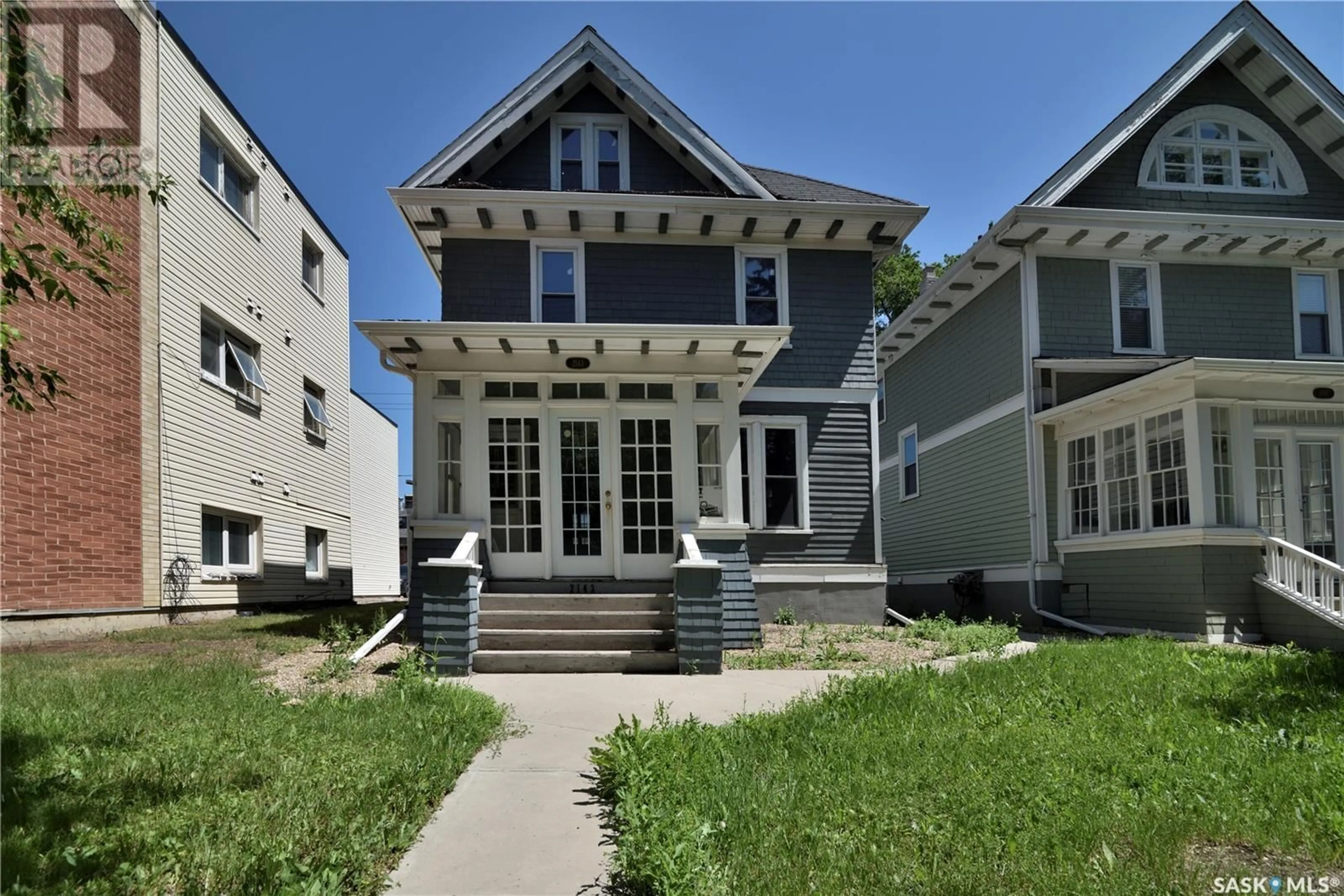 Home with vinyl exterior material, street for 2143 ANGUS STREET, Regina Saskatchewan S4T2A1