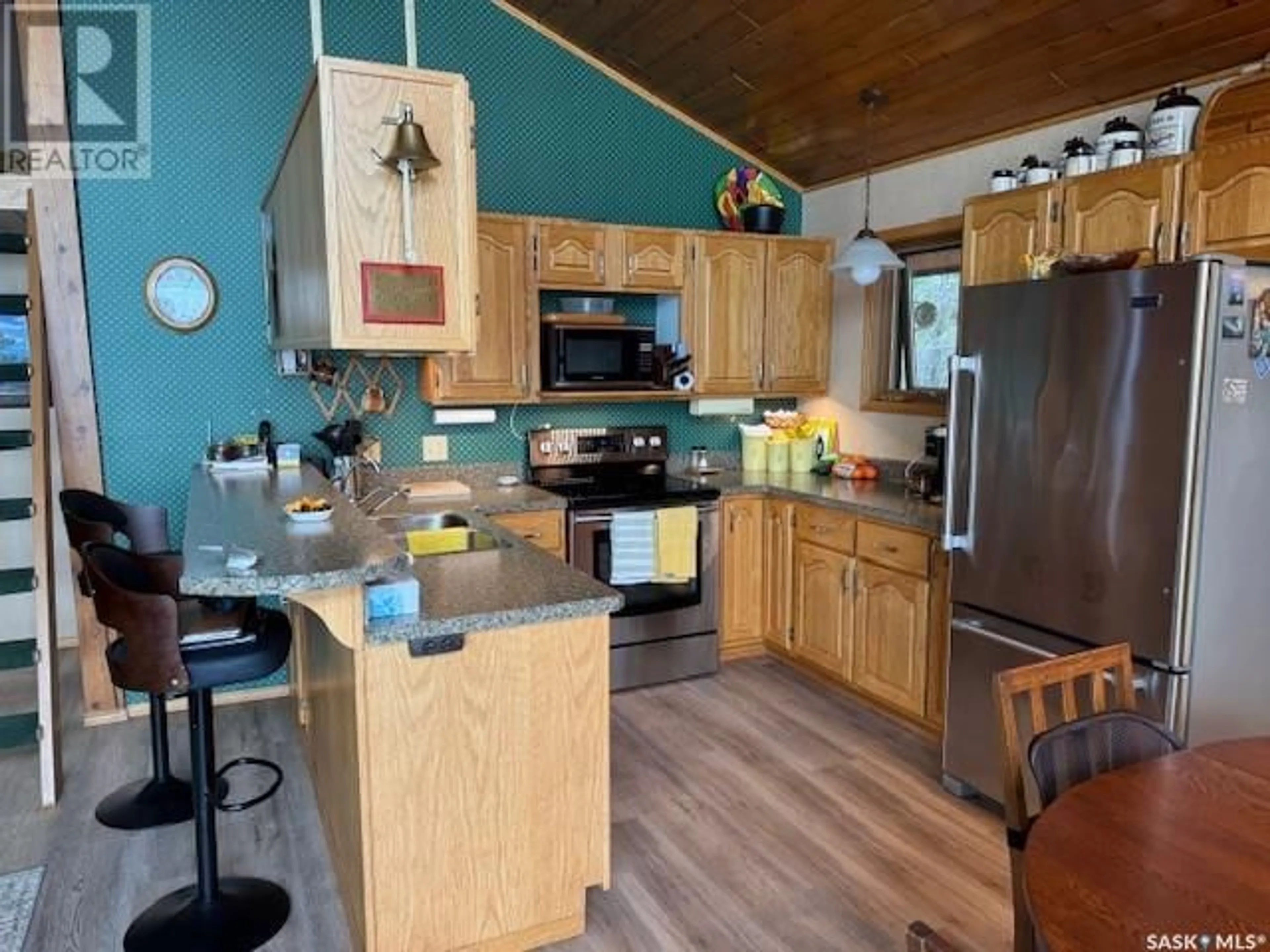 Open concept kitchen, wood/laminate floor for 502 EVERGREEN ROAD, Mervin Rm No.499 Saskatchewan S0M1J0