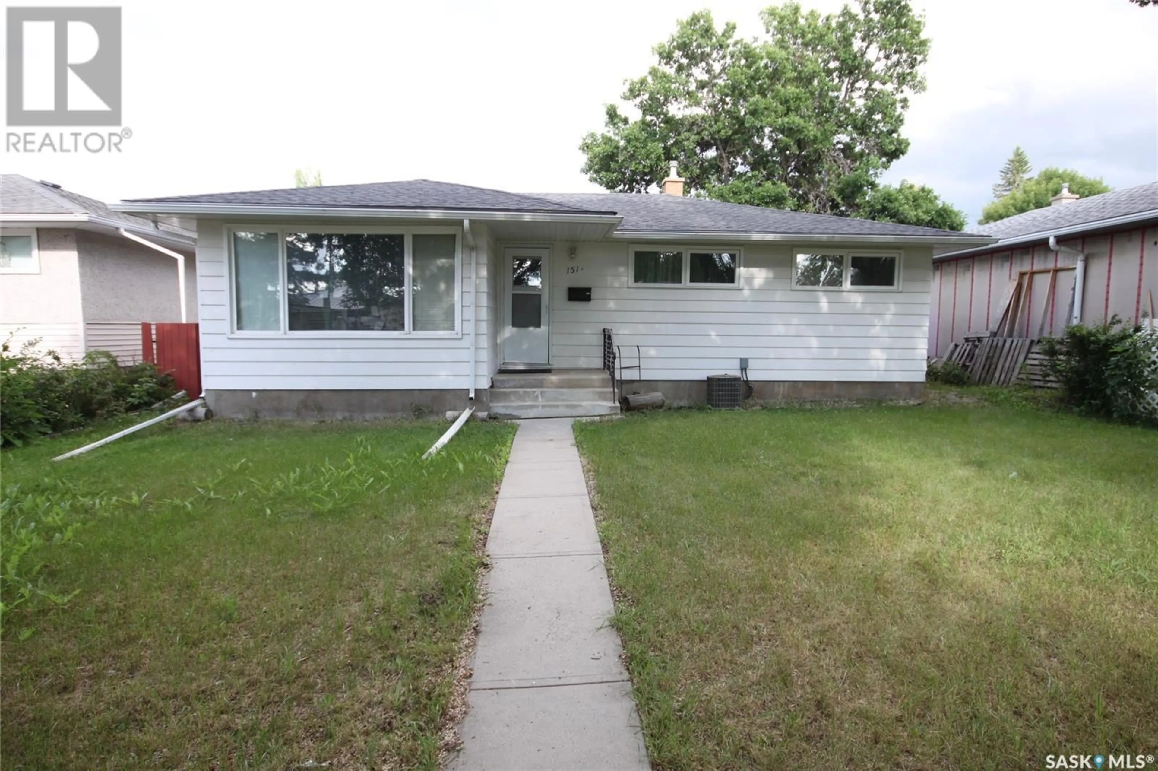 Home with vinyl exterior material, street for 151 SMITH STREET, Regina Saskatchewan S4R3B3