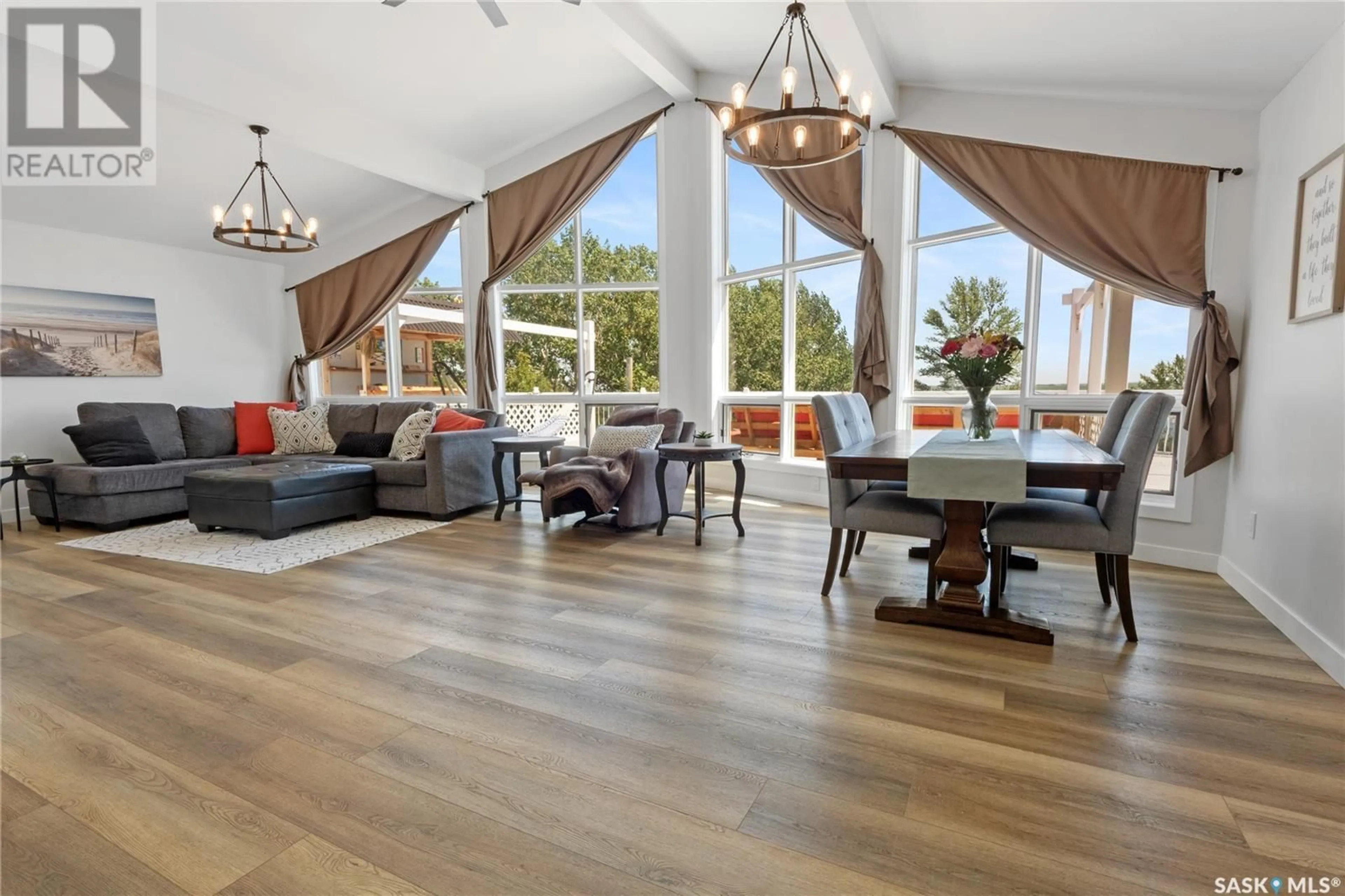 Living room with furniture, wood/laminate floor for 4 MAWSON DRIVE, Shields Saskatchewan S7C0A2