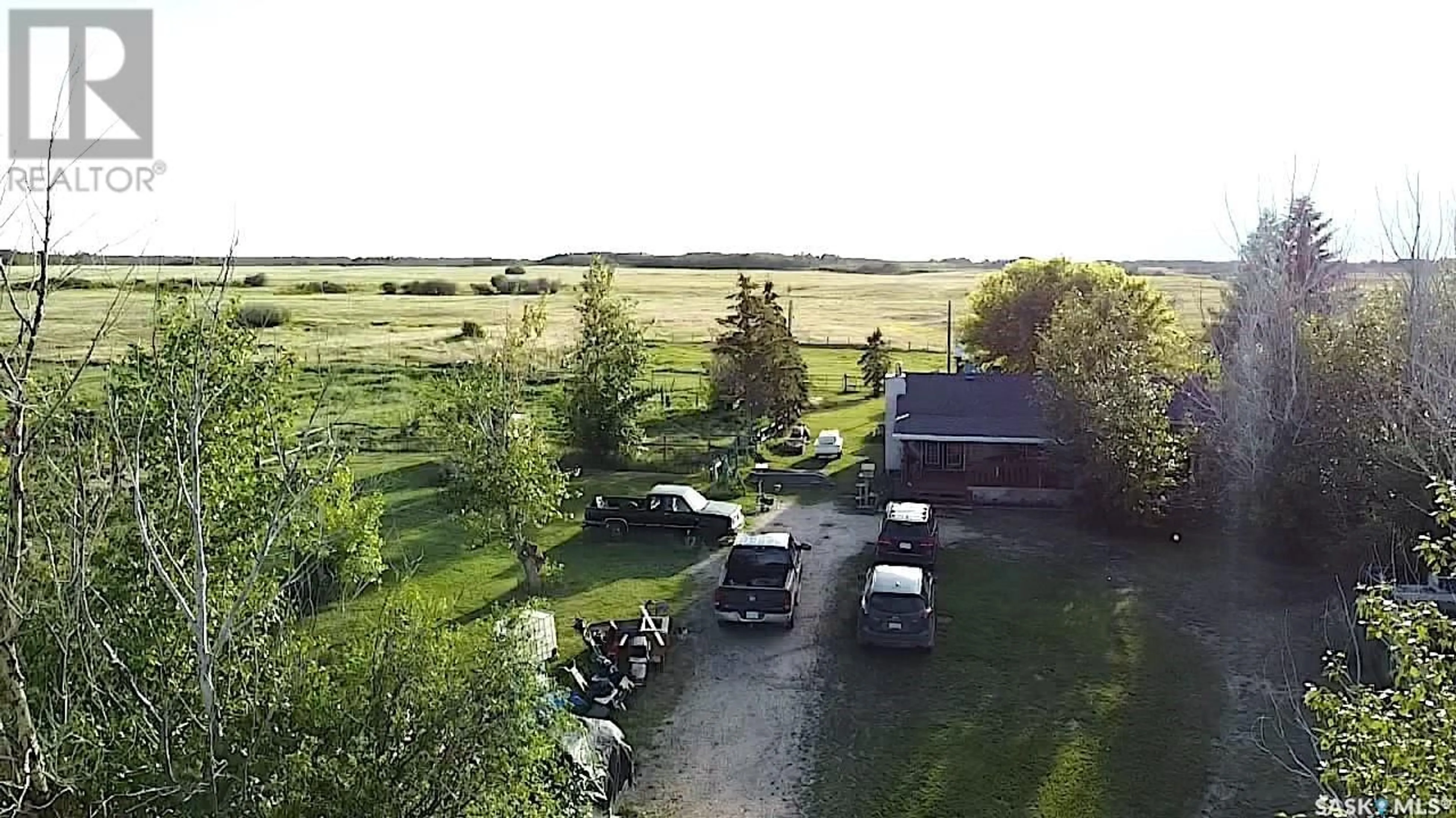 A pic from outside/outdoor area/front of a property/back of a property/a pic from drone, water/lake/river/ocean view for KRELLER ACREAGE, Biggar Rm No. 347 Saskatchewan S0K0M0