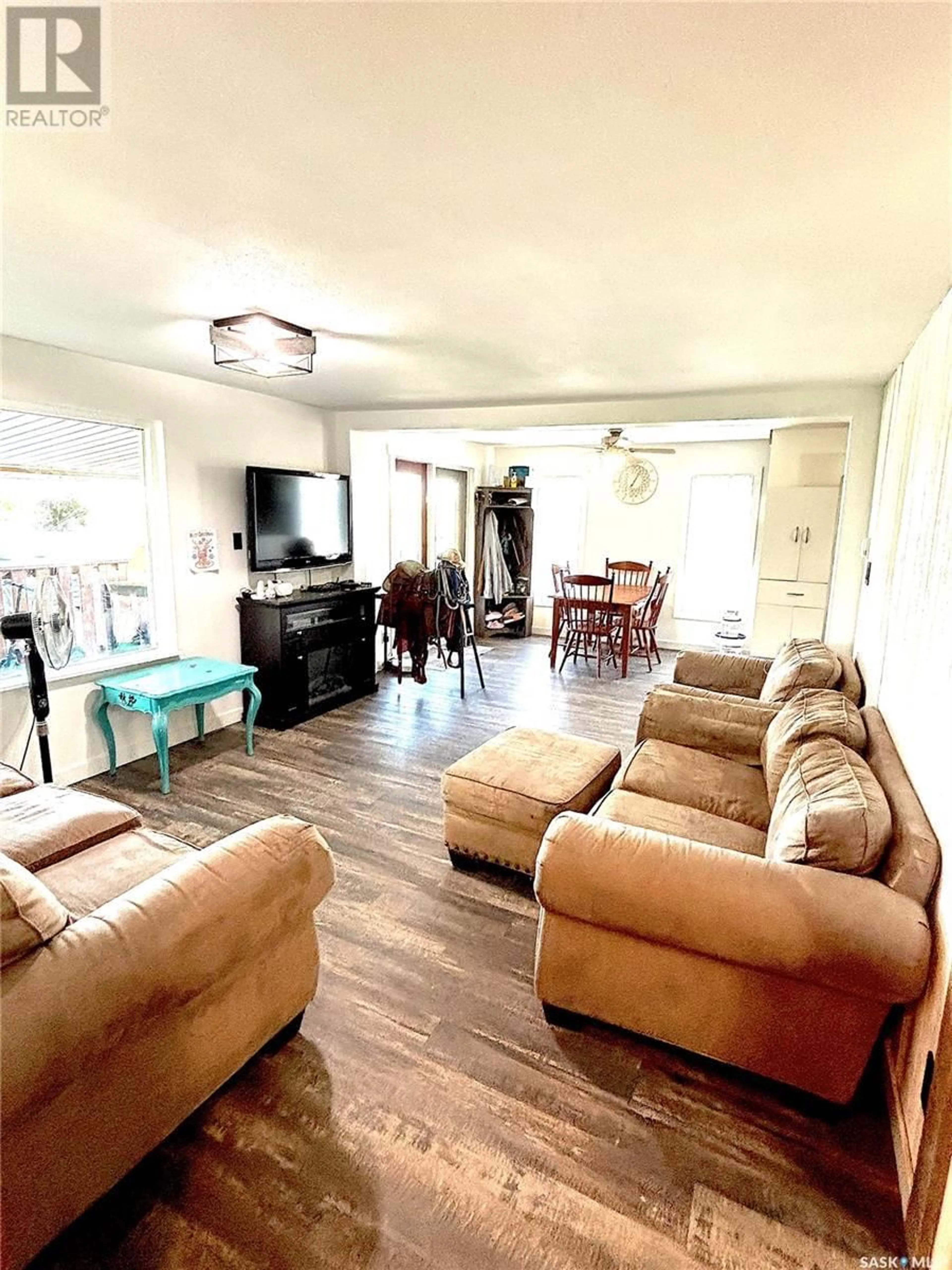 Living room with furniture, wood/laminate floor for KRELLER ACREAGE, Biggar Rm No. 347 Saskatchewan S0K0M0