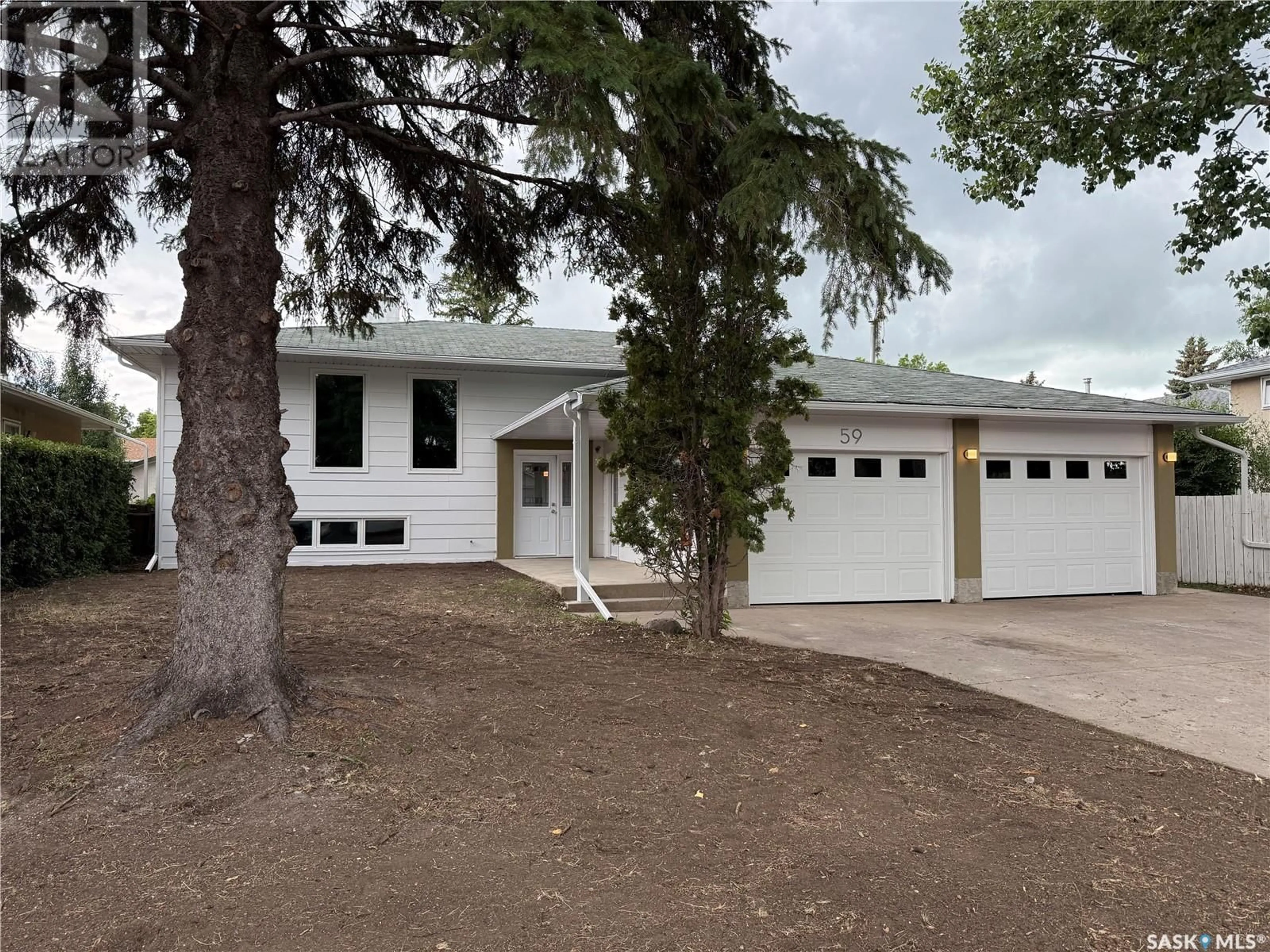 Home with vinyl exterior material, street for 59 ANDRE AVENUE, Regina Saskatchewan S4T7C9