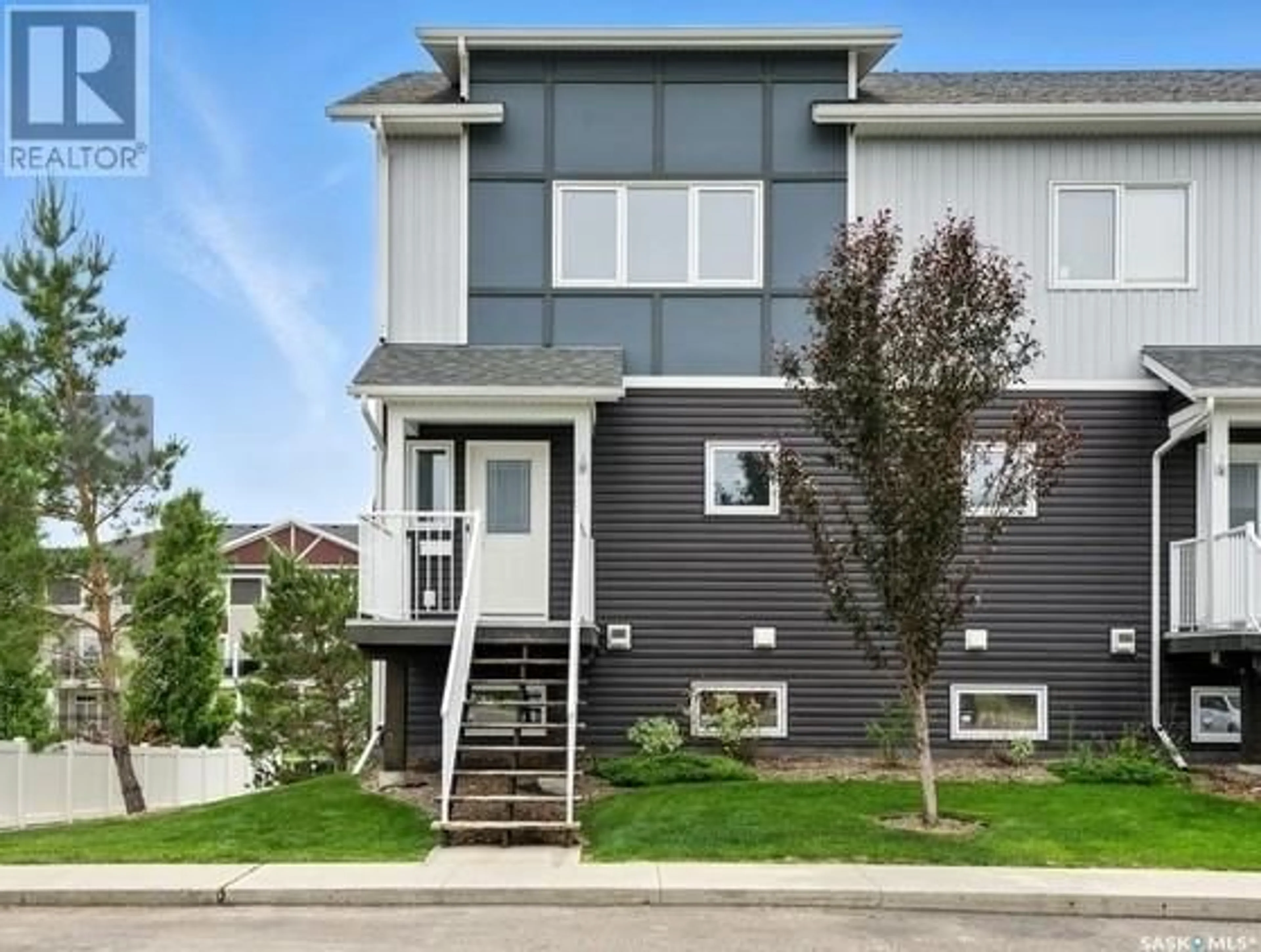 Home with vinyl exterior material, street for 302 225 HASSARD CLOSE, Saskatoon Saskatchewan S7L2W3
