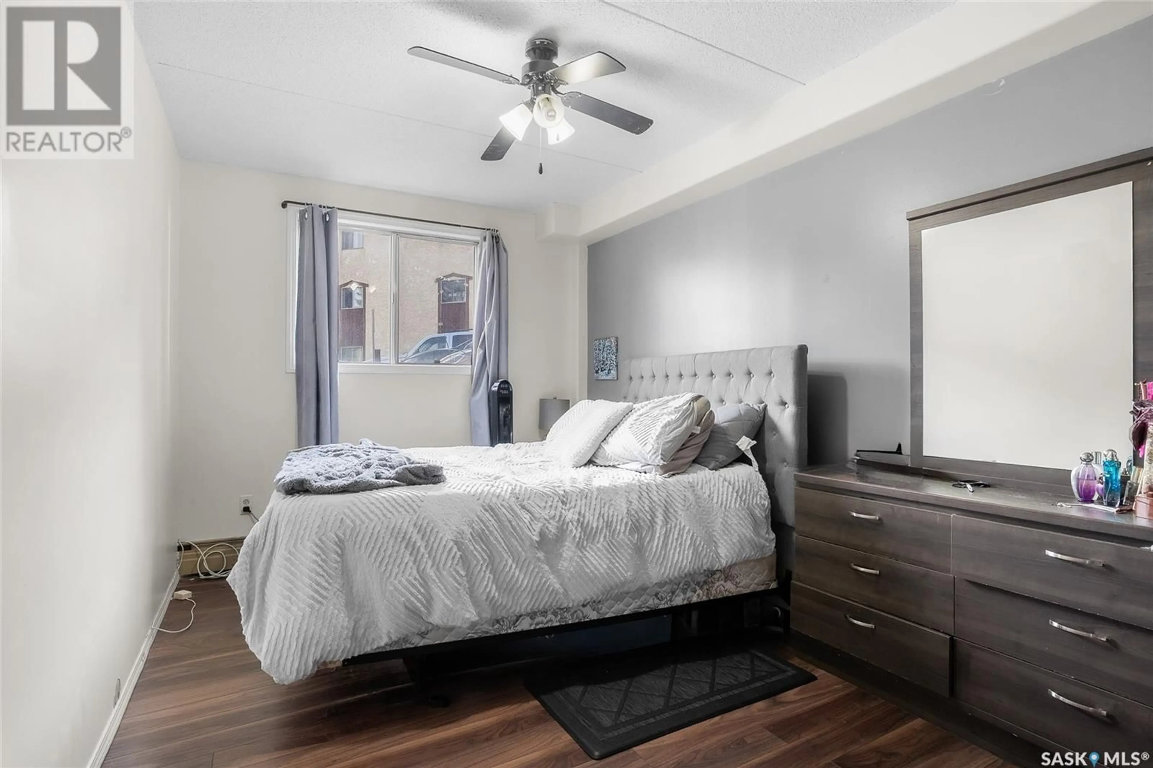 Bedroom with bed, wood/laminate floor for 20 - 11 ASSINIBOINE DRIVE, Saskatoon Saskatchewan S7K1H2