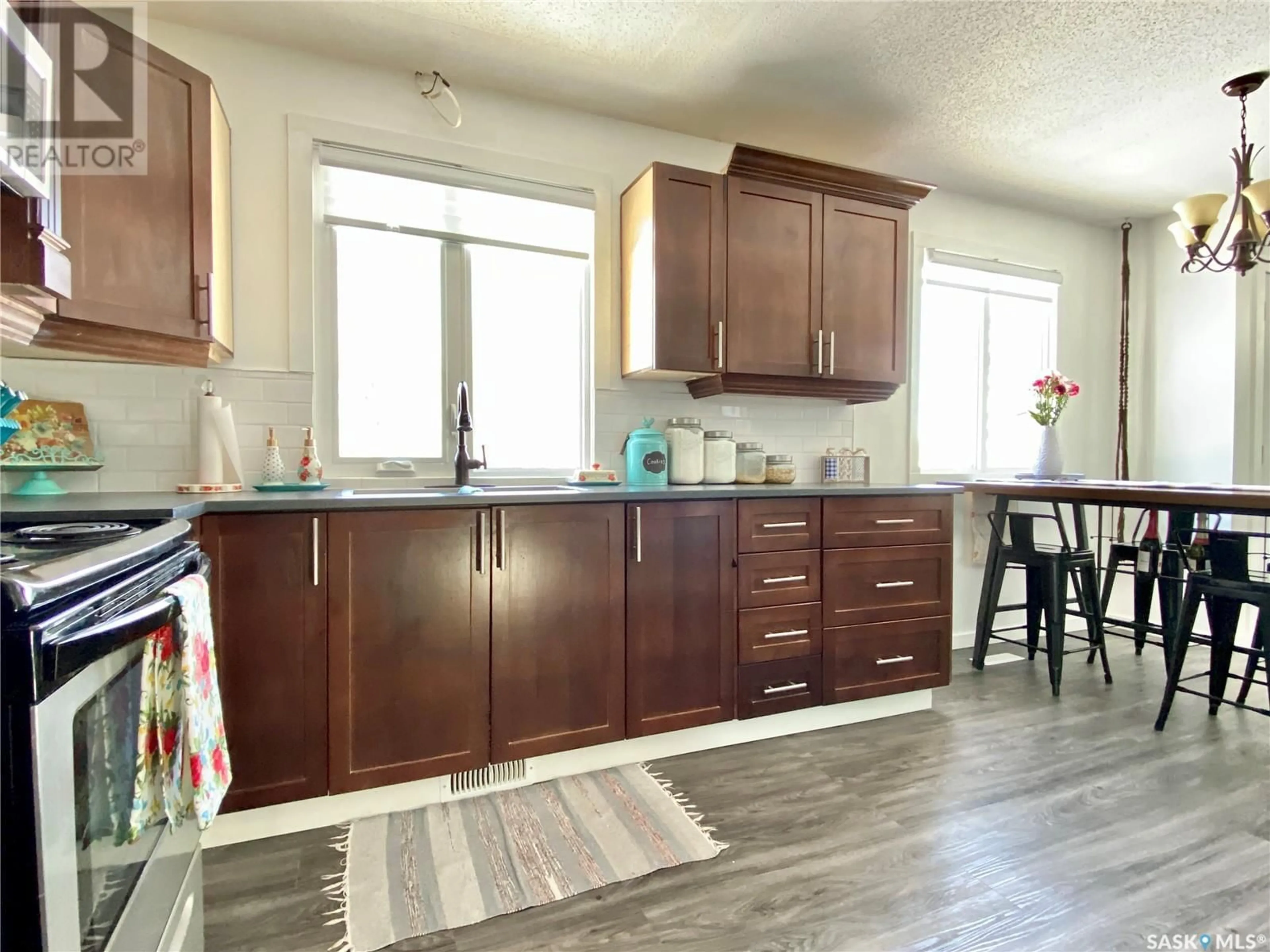 Open concept kitchen, wood/laminate floor for 26 NOEL STREET, Dubuc Saskatchewan S0A0R0