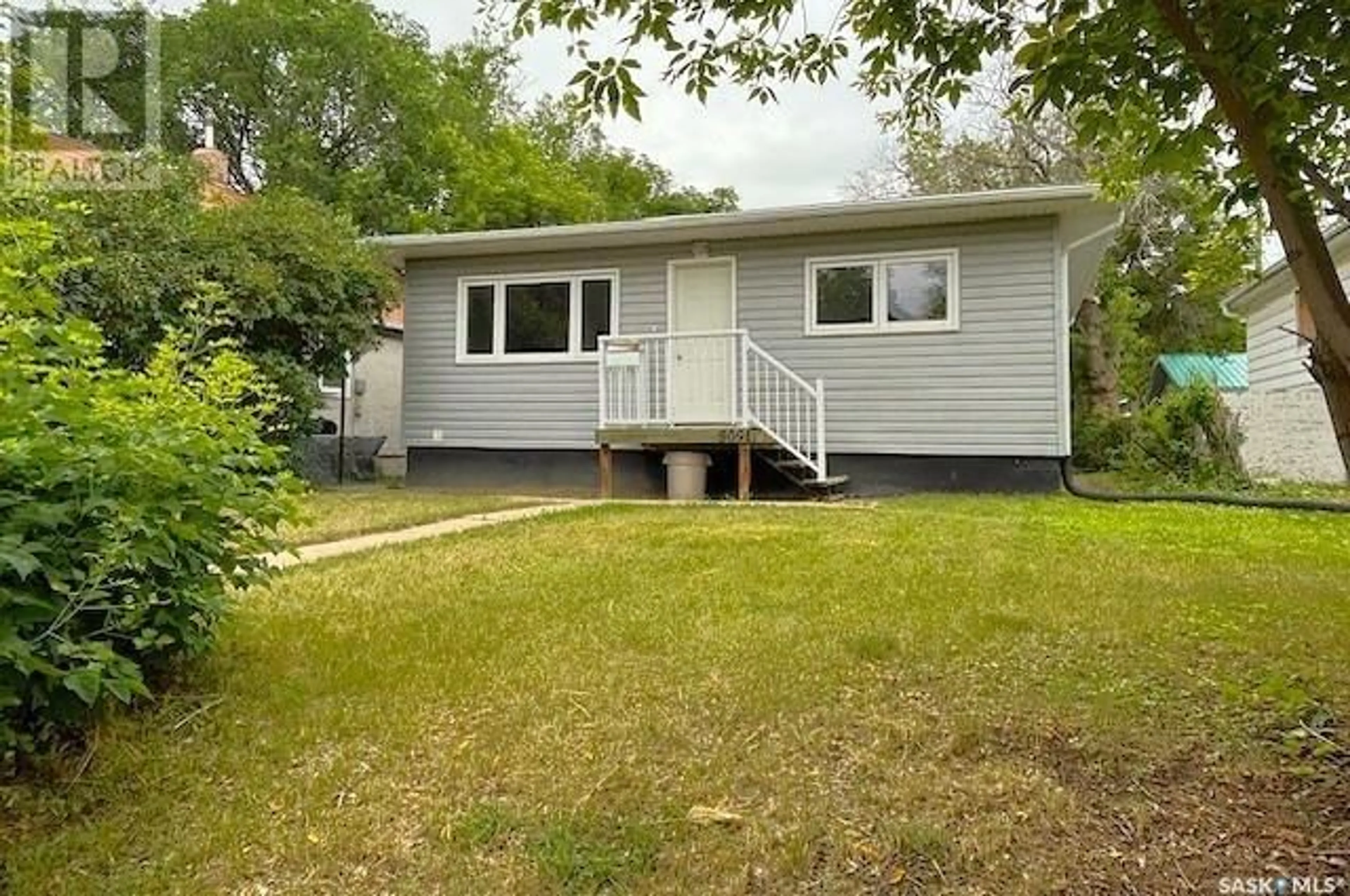 A pic from outside/outdoor area/front of a property/back of a property/a pic from drone, street for 809 CARTIER AVENUE, Moose Jaw Saskatchewan S6H1L9