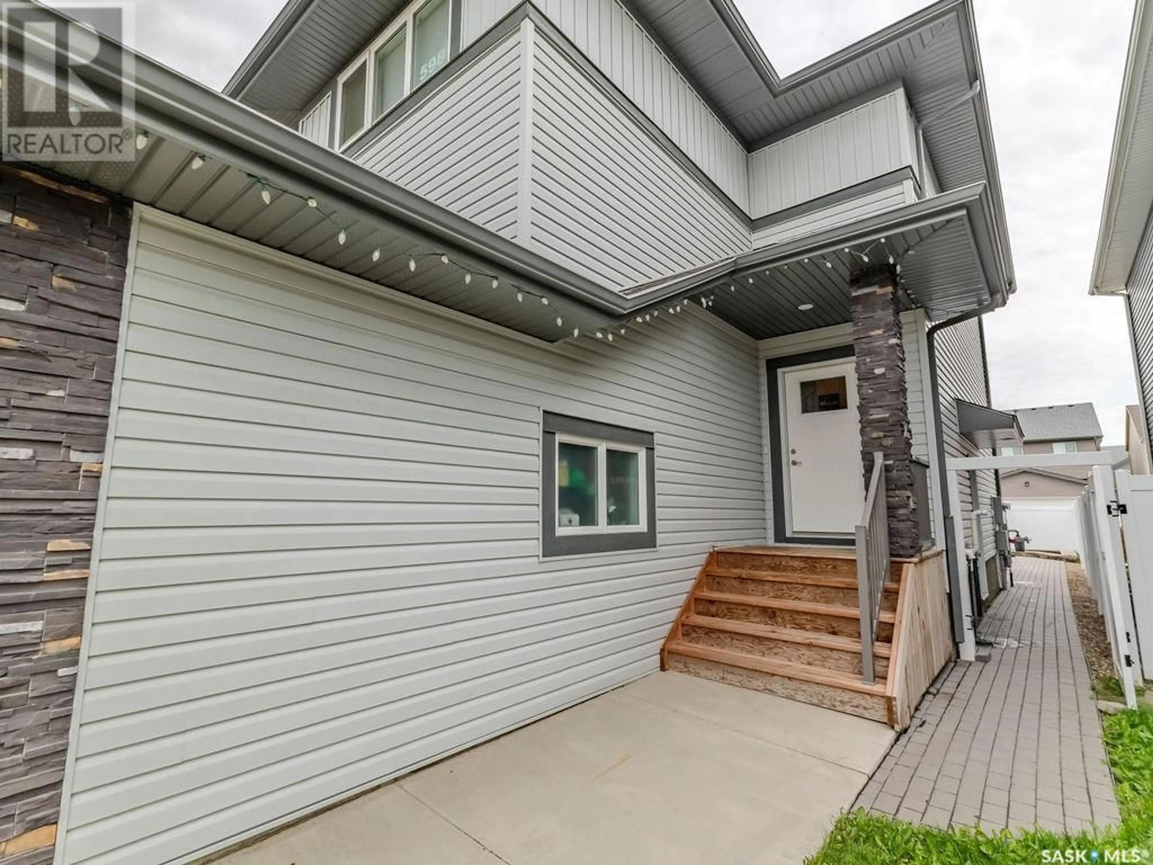 Home with vinyl exterior material, street for 598 MCFAULL CRESCENT, Saskatoon Saskatchewan S7V0T3