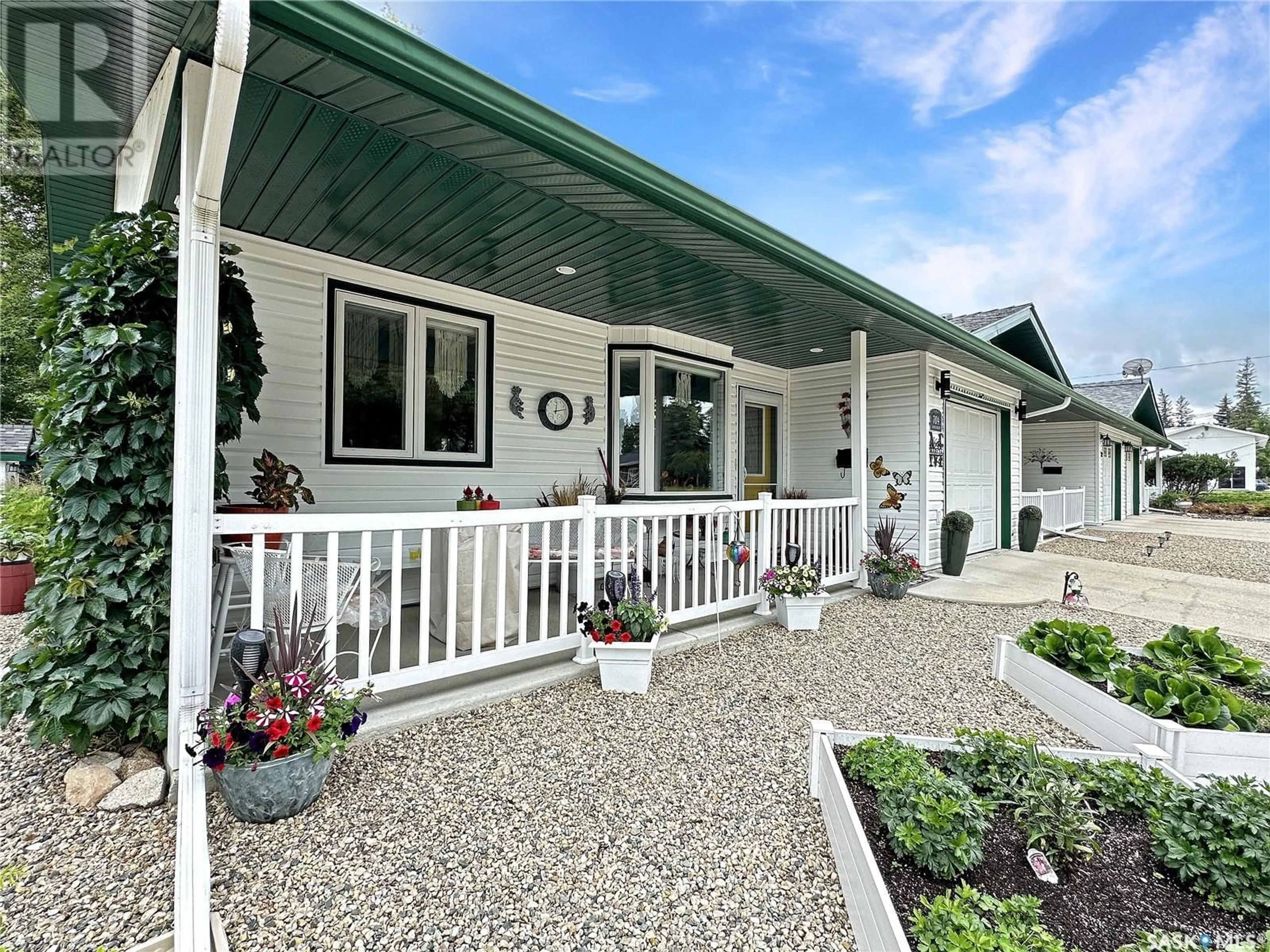 Home with vinyl exterior material, street for 704 EDEN STREET, Indian Head Saskatchewan S0G2K0