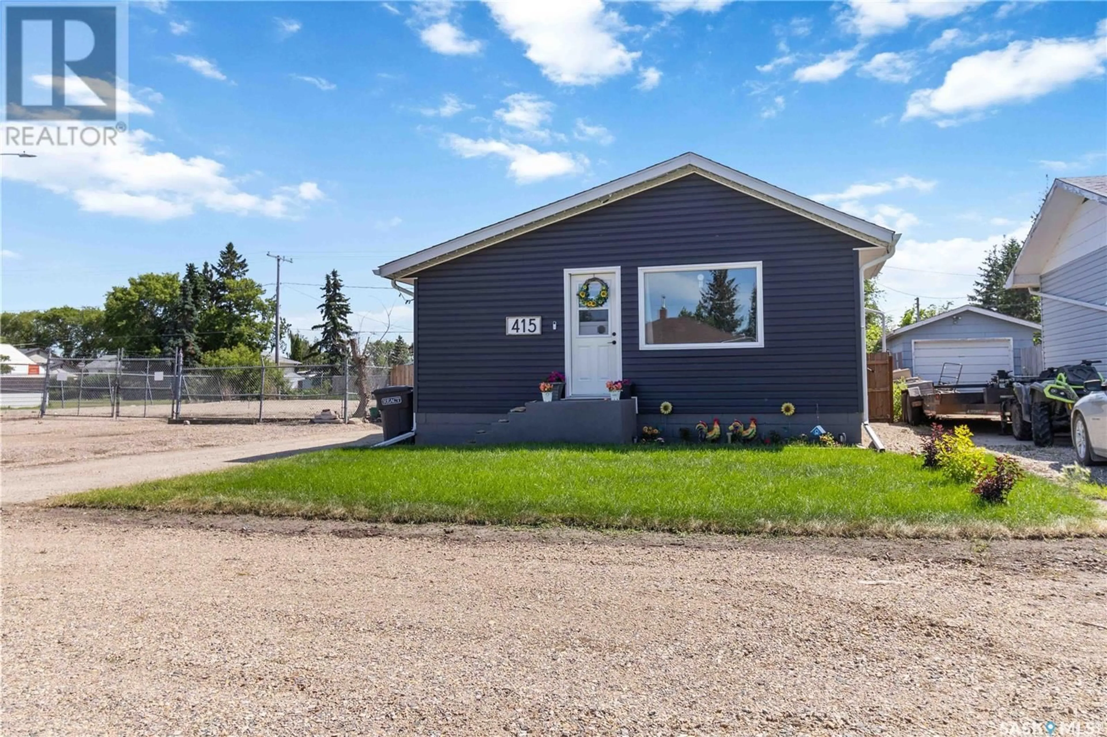 Home with vinyl exterior material, street for 415 3RD STREET, Wakaw Saskatchewan S0K4P0