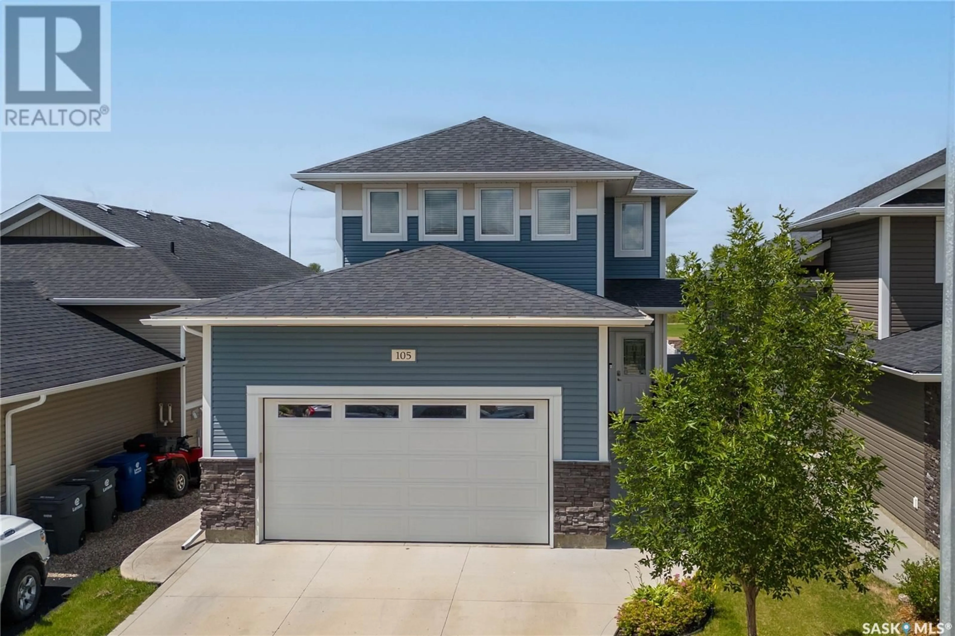 Home with vinyl exterior material, street for 105 COWAN CRESCENT, Martensville Saskatchewan S0K2T1