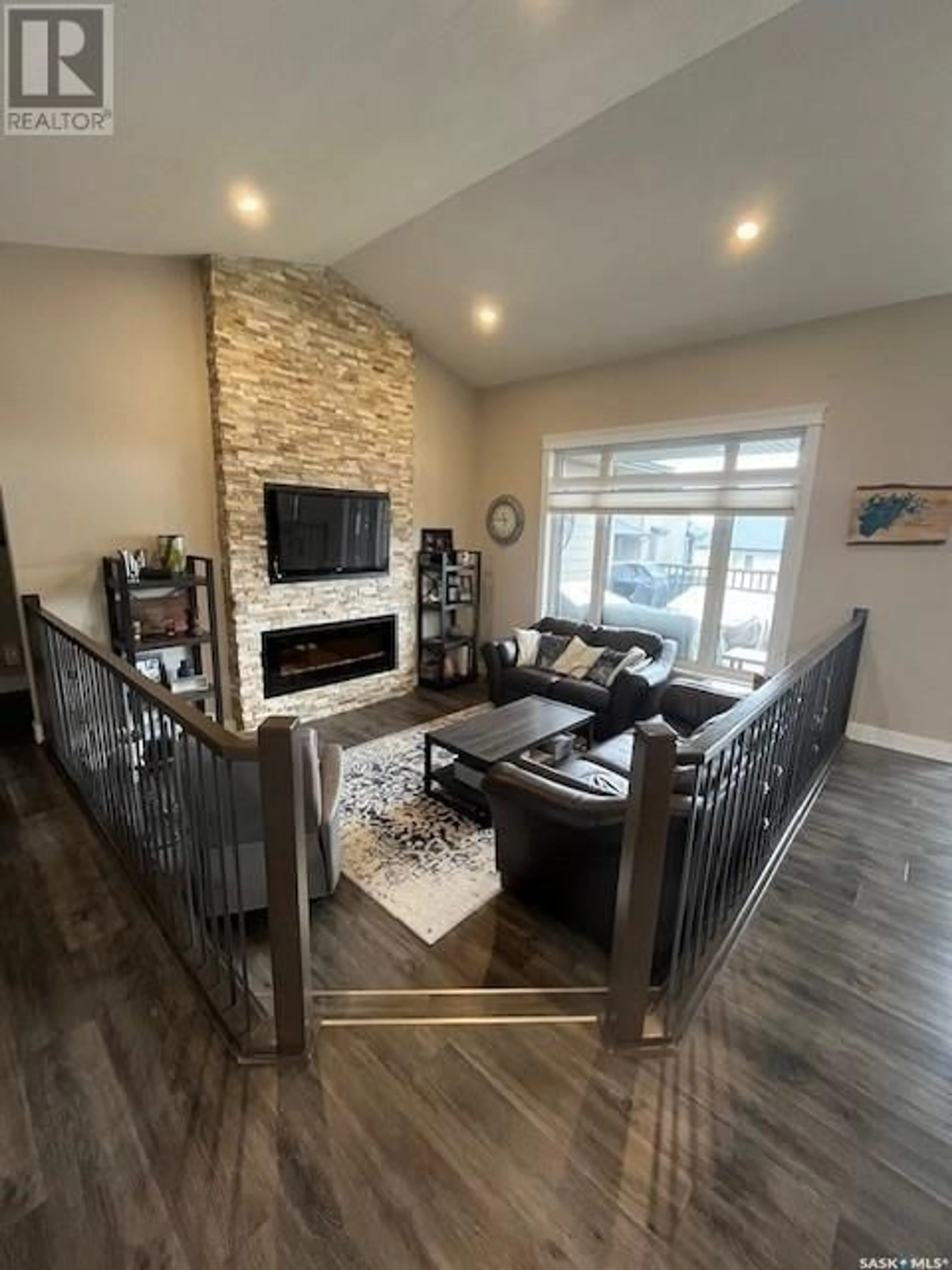 Living room with furniture, wood/laminate floor for 28 SMILEY DRIVE, Prince Albert Saskatchewan S6X0B3