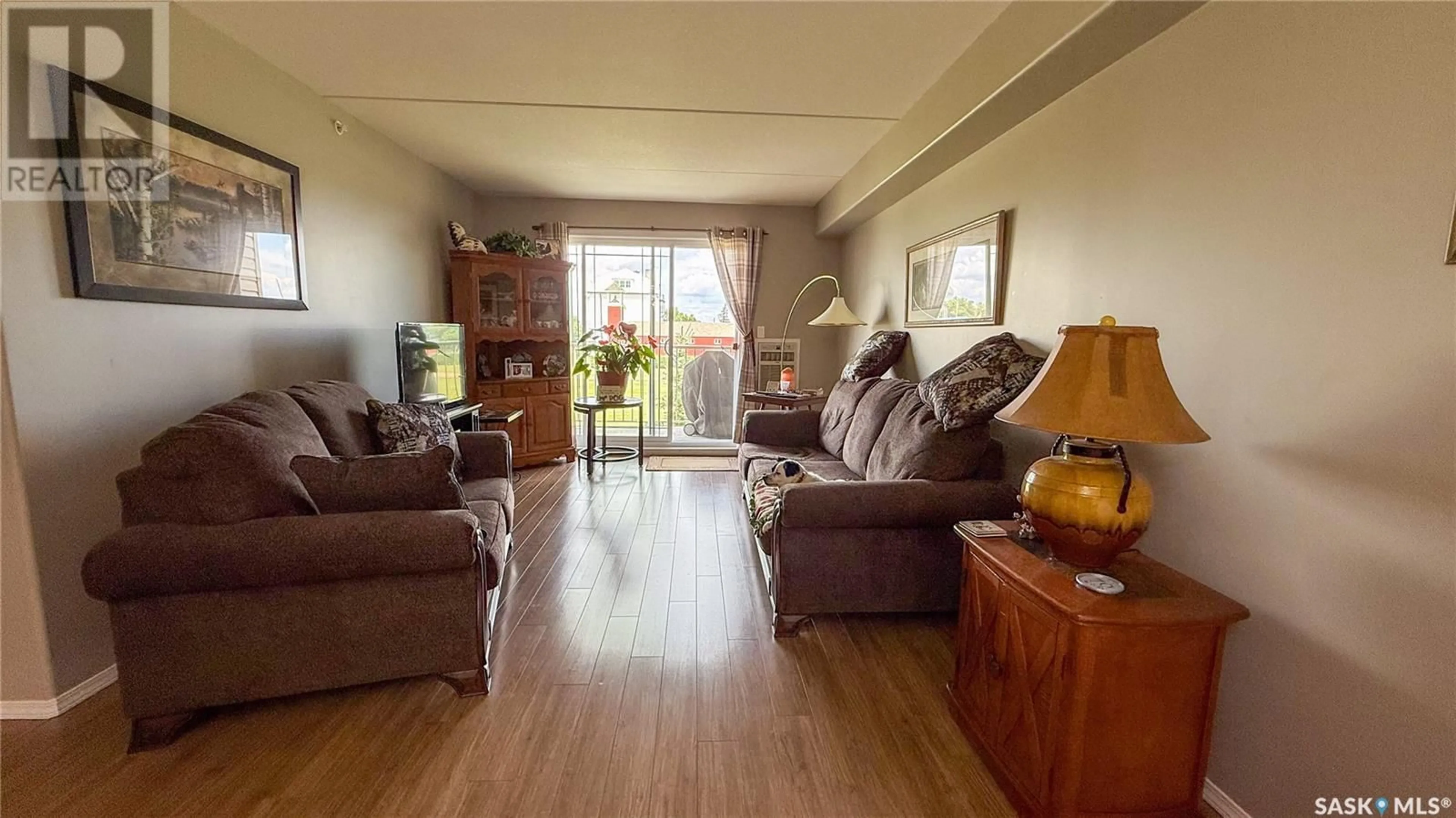 Living room with furniture, wood/laminate floor for 18th - 2 206 STREET, Battleford Saskatchewan S0M0E0