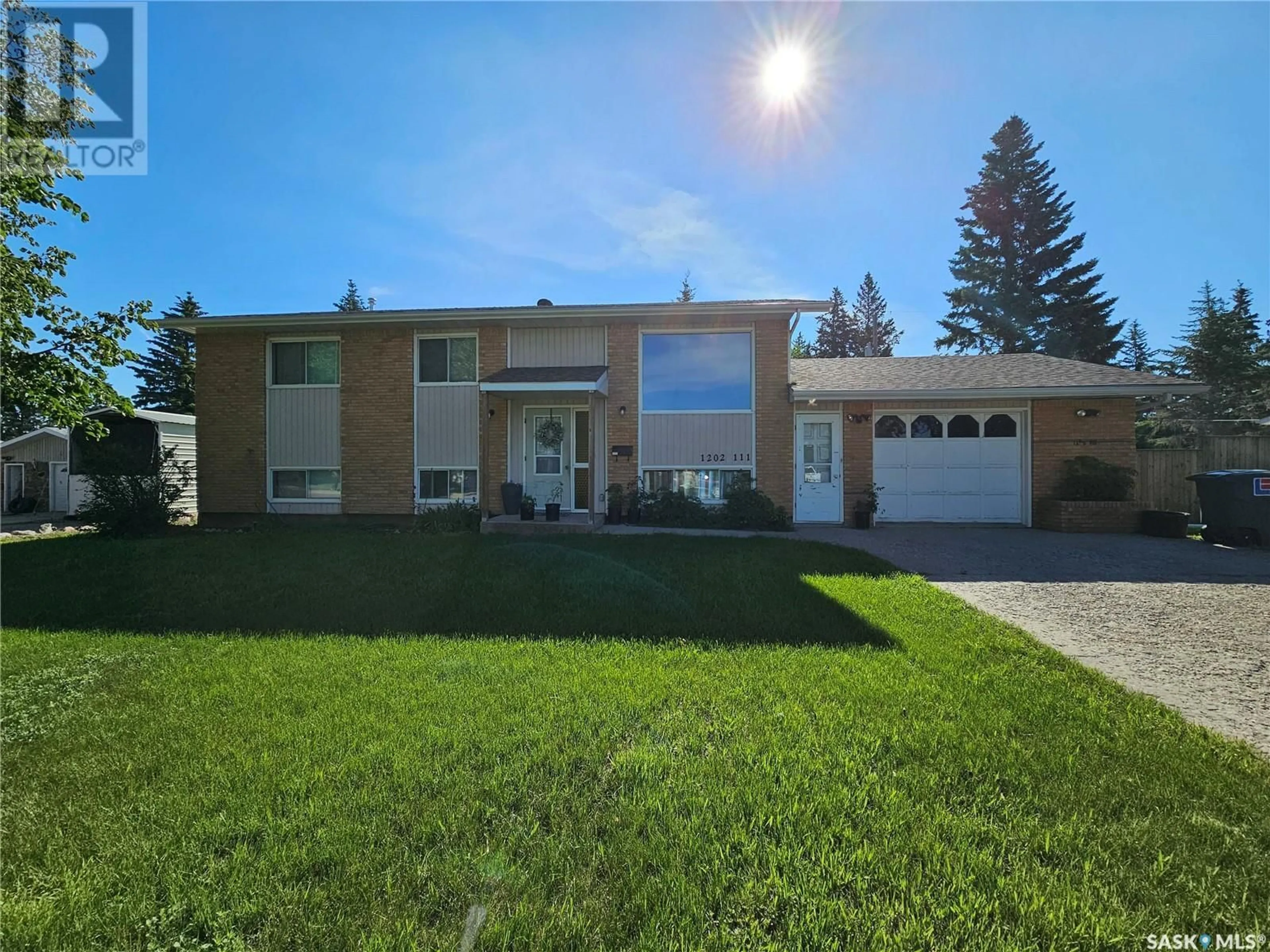 Home with brick exterior material, street for 1202 111TH STREET, North Battleford Saskatchewan S9A3M3