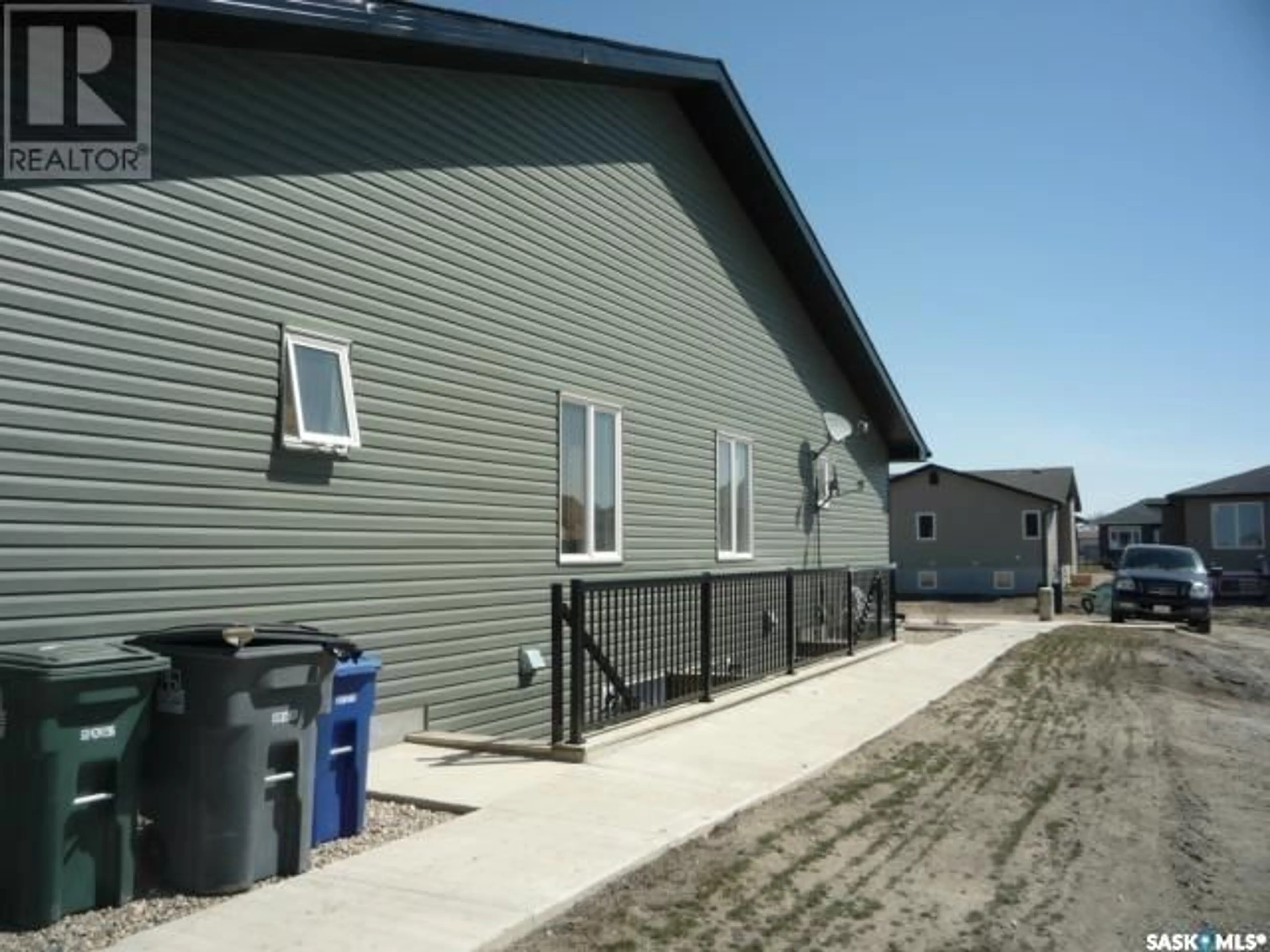 Home with vinyl exterior material, building for 201 - 4 CARLYLE AVENUE, Carlyle Saskatchewan S0C0R0