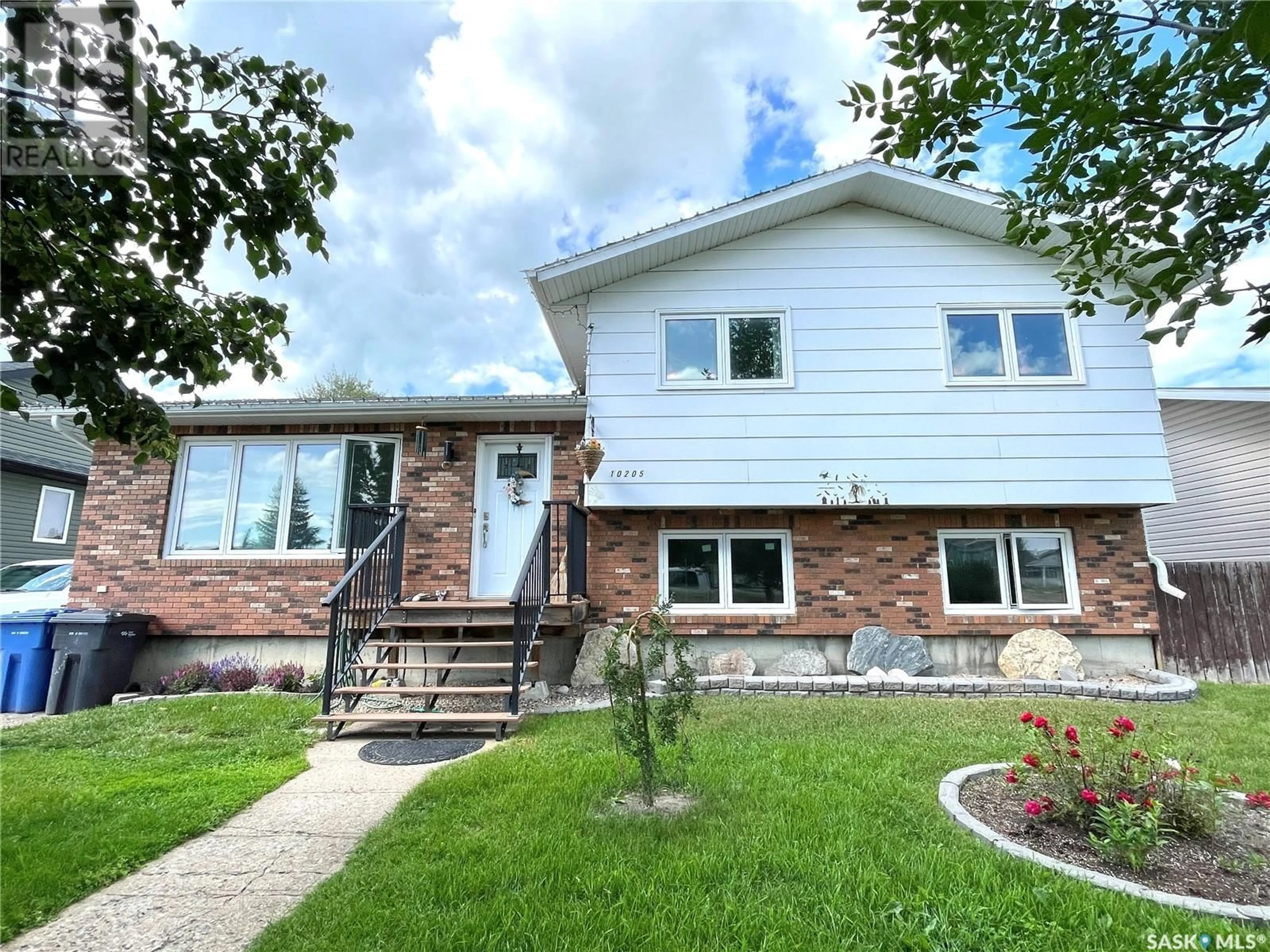Home with vinyl exterior material, street for 10205 CAMPBELL CRESCENT, North Battleford Saskatchewan S9A3S3