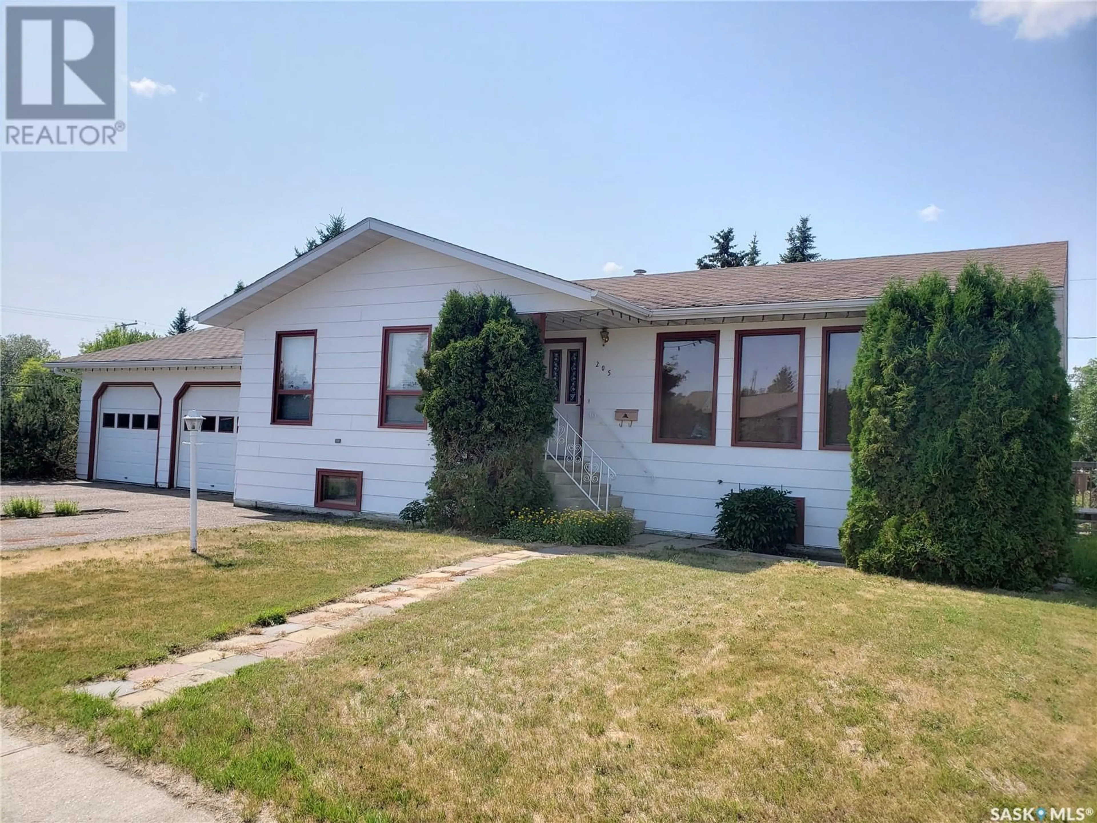 Home with vinyl exterior material, street for 205 2ND STREET, Wilkie Saskatchewan S0K4W0