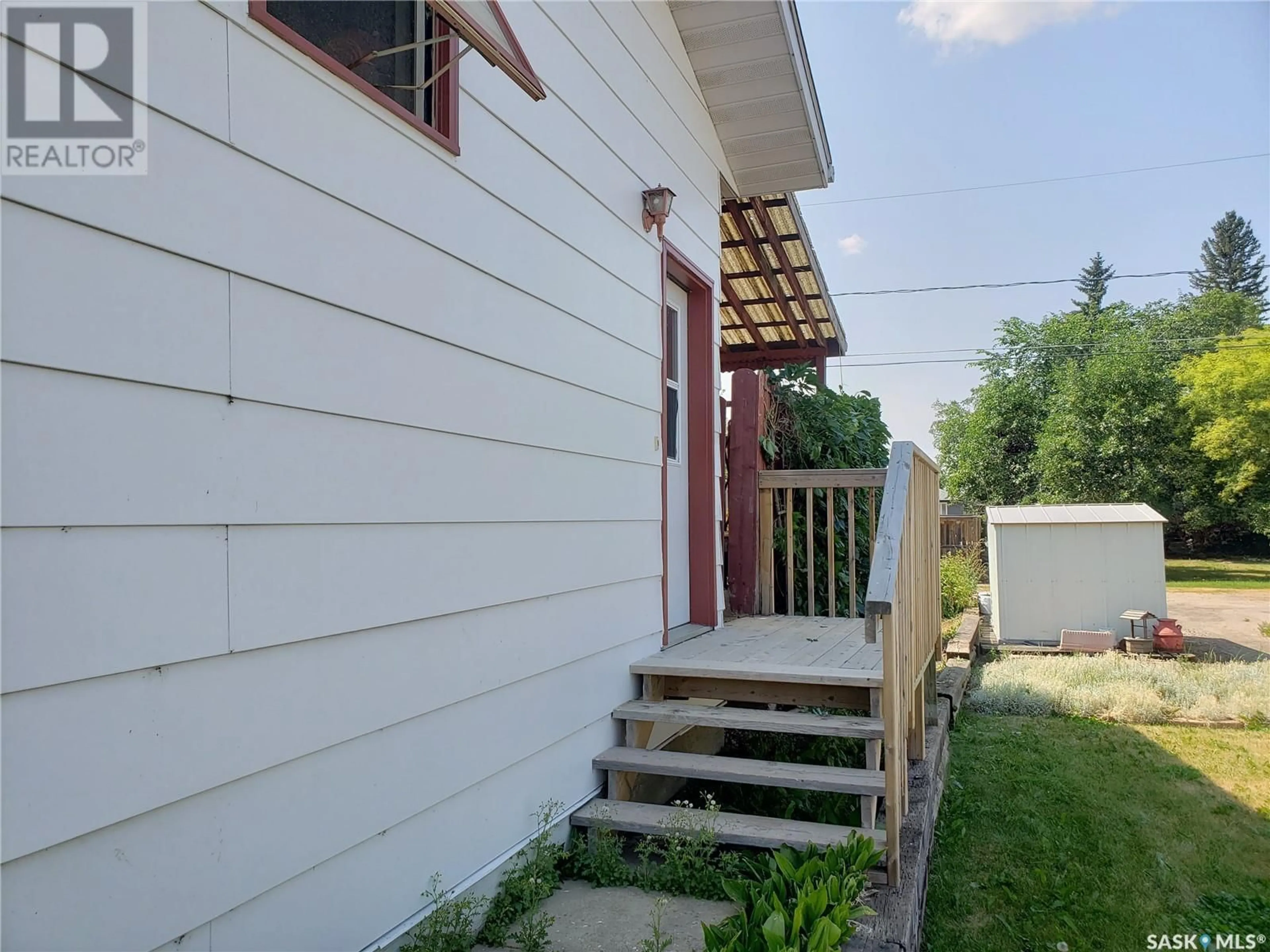 Home with vinyl exterior material, street for 205 2ND STREET, Wilkie Saskatchewan S0K4W0