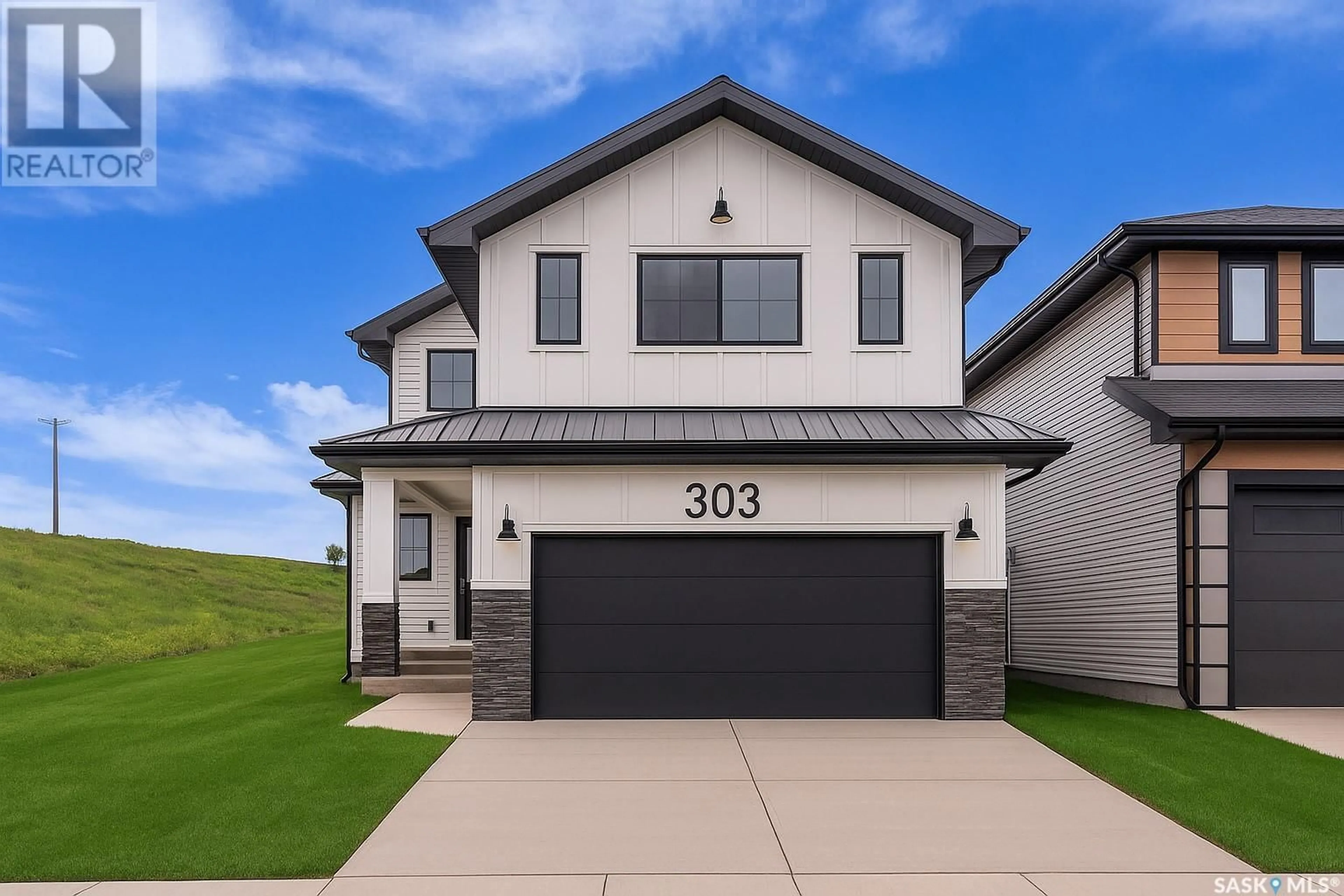 Home with vinyl exterior material, street for 303 ASOKAN STREET, Saskatoon Saskatchewan S7V1S4