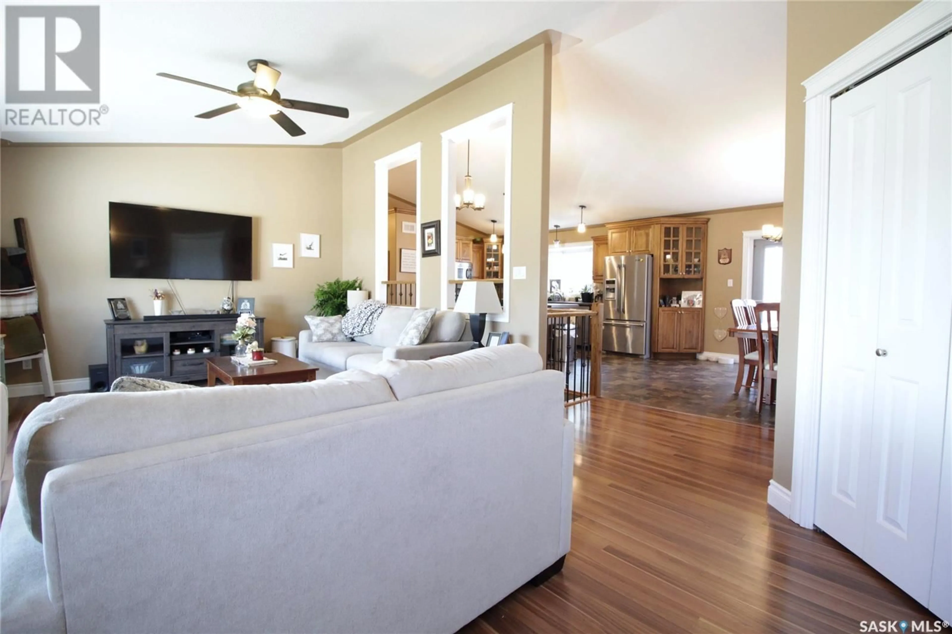 Living room with furniture, wood/laminate floor for 513 HENRY STREET, Moosomin Saskatchewan S0G3N0