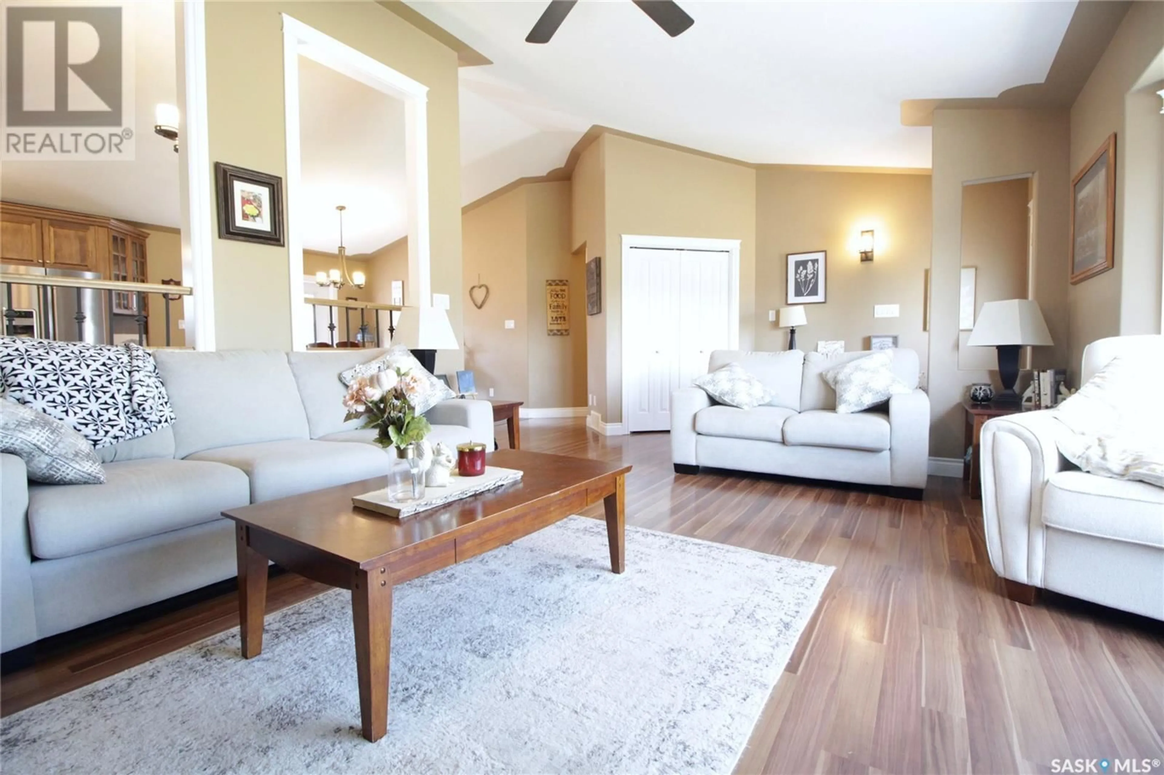 Living room with furniture, wood/laminate floor for 513 HENRY STREET, Moosomin Saskatchewan S0G3N0