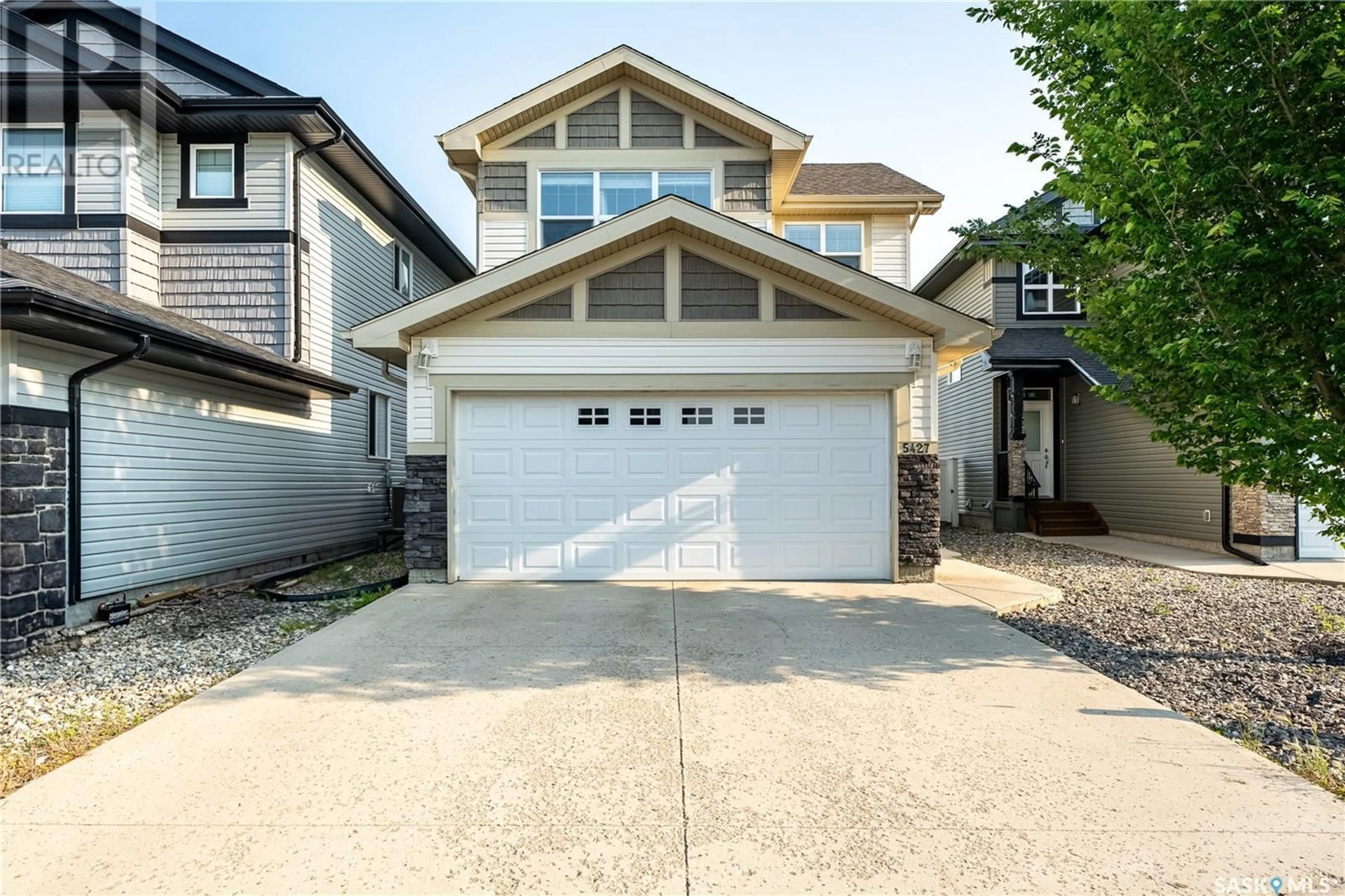 Home with vinyl exterior material, street for 5427 UNIVERSAL CRESCENT, Regina Saskatchewan S4W0K8