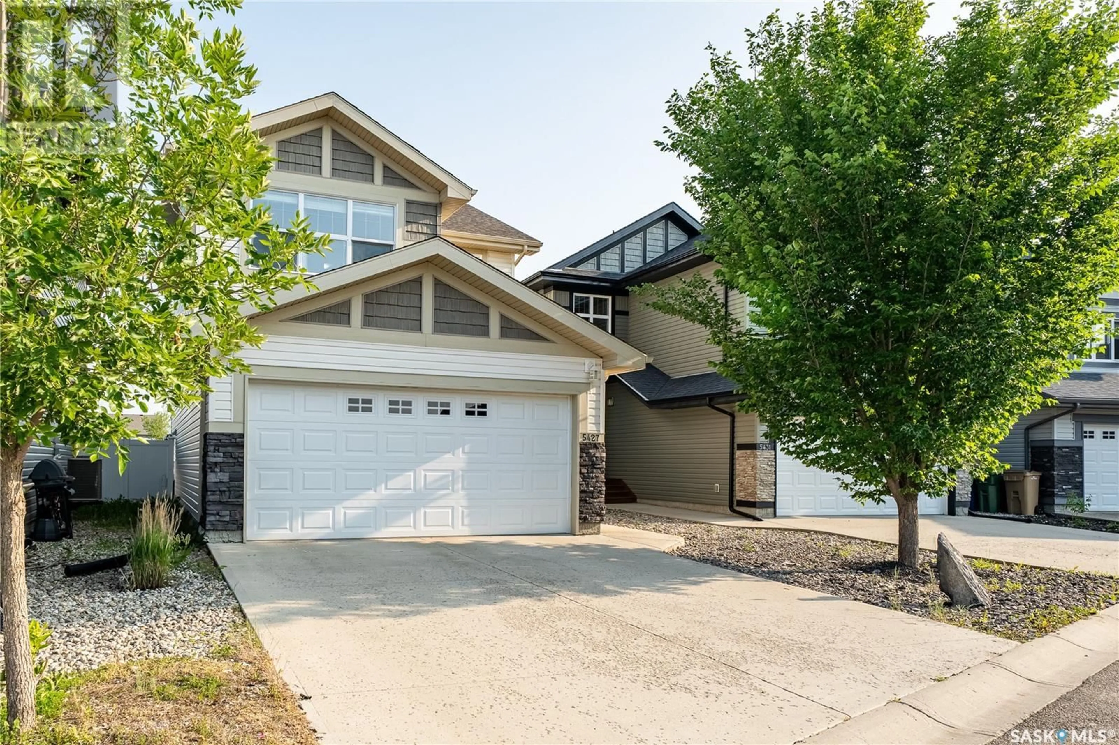 Home with vinyl exterior material, street for 5427 UNIVERSAL CRESCENT, Regina Saskatchewan S4W0K8