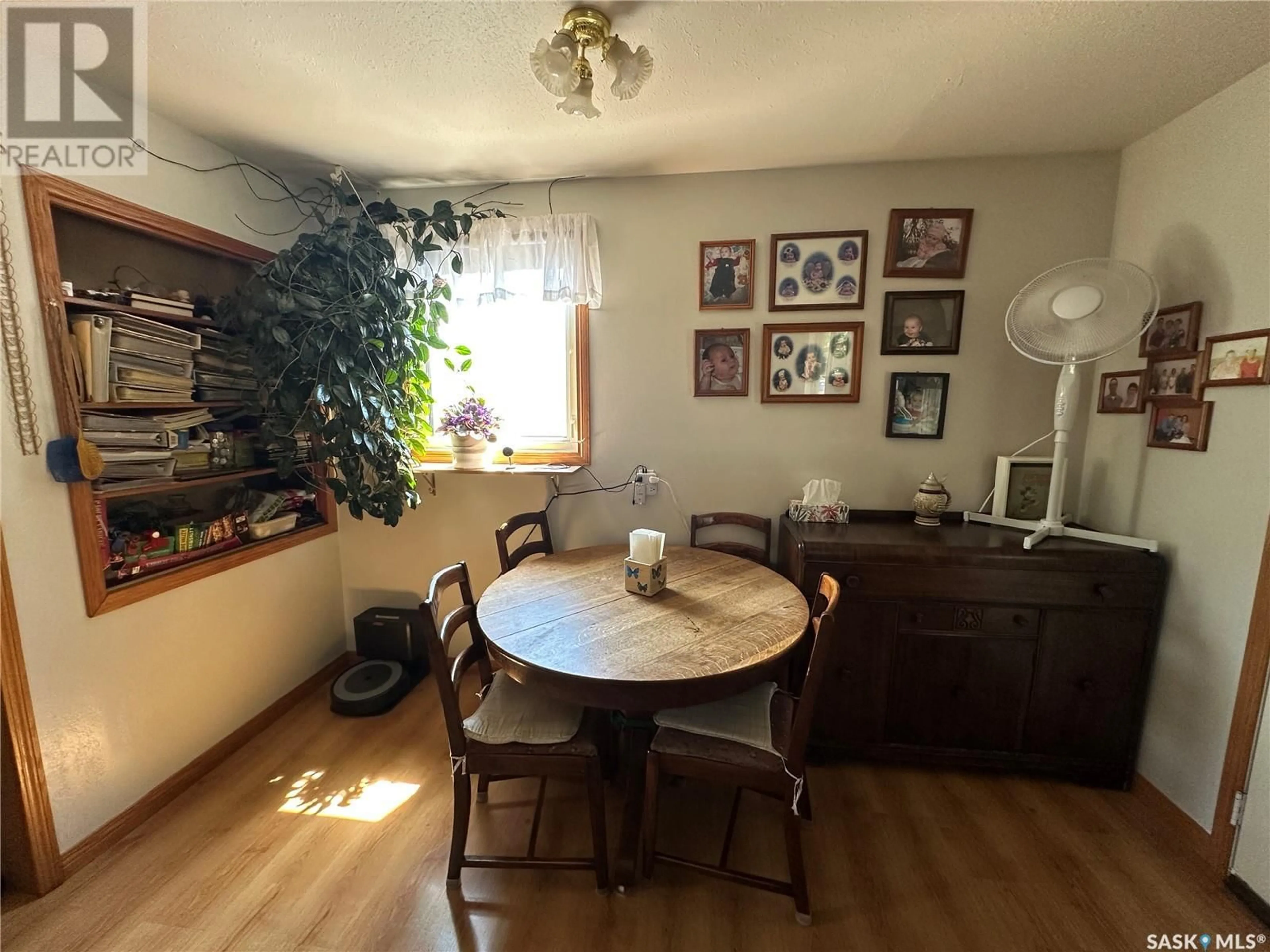 Dining room, wood/laminate floor for 18 9TH STREET, Weyburn Saskatchewan S4H1E5
