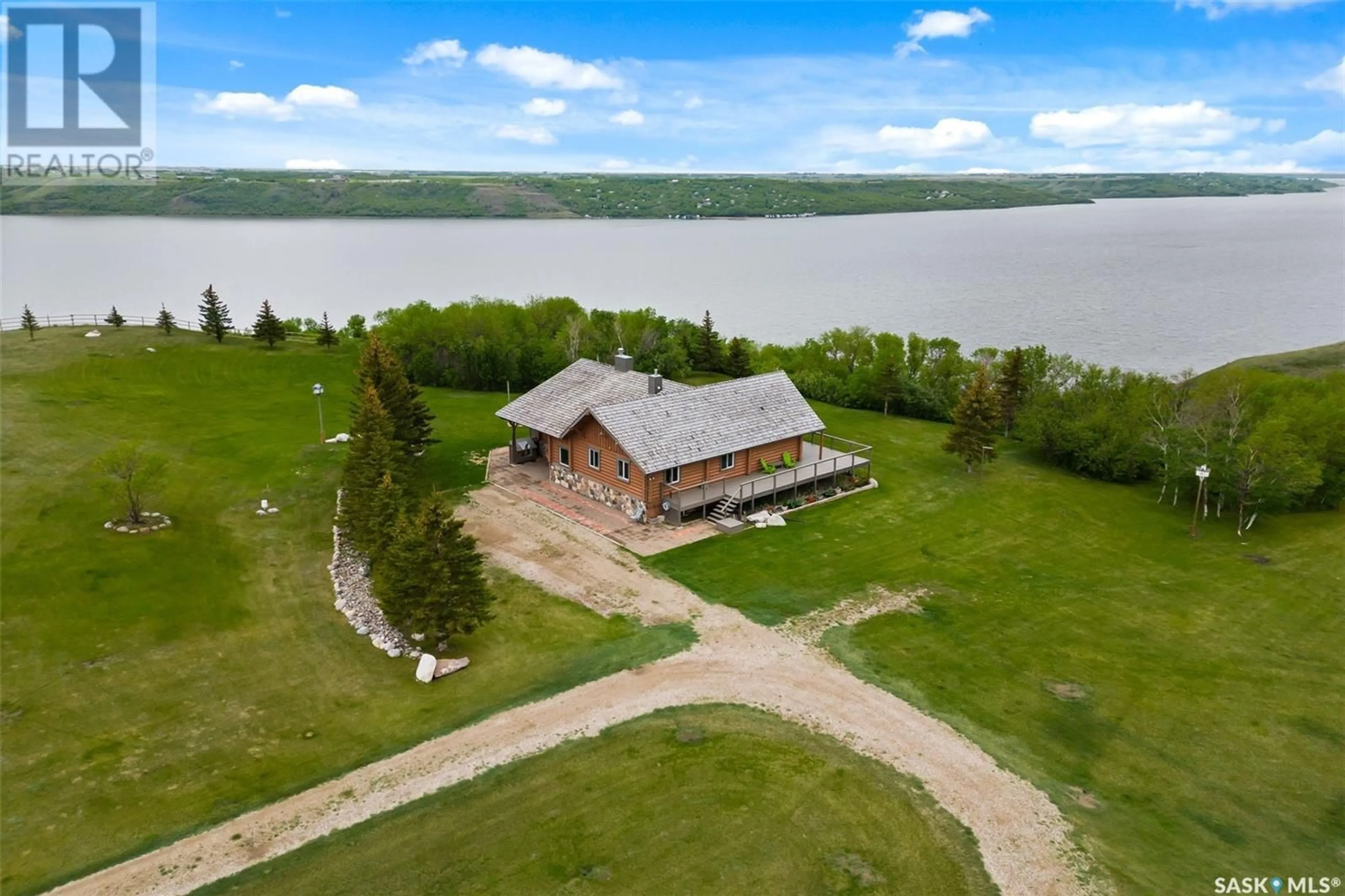 A pic from outside/outdoor area/front of a property/back of a property/a pic from drone, water/lake/river/ocean view for Last Mountain Lake - BIG BROWN BARN, Longlaketon Rm No. 219 Saskatchewan S0G0W0