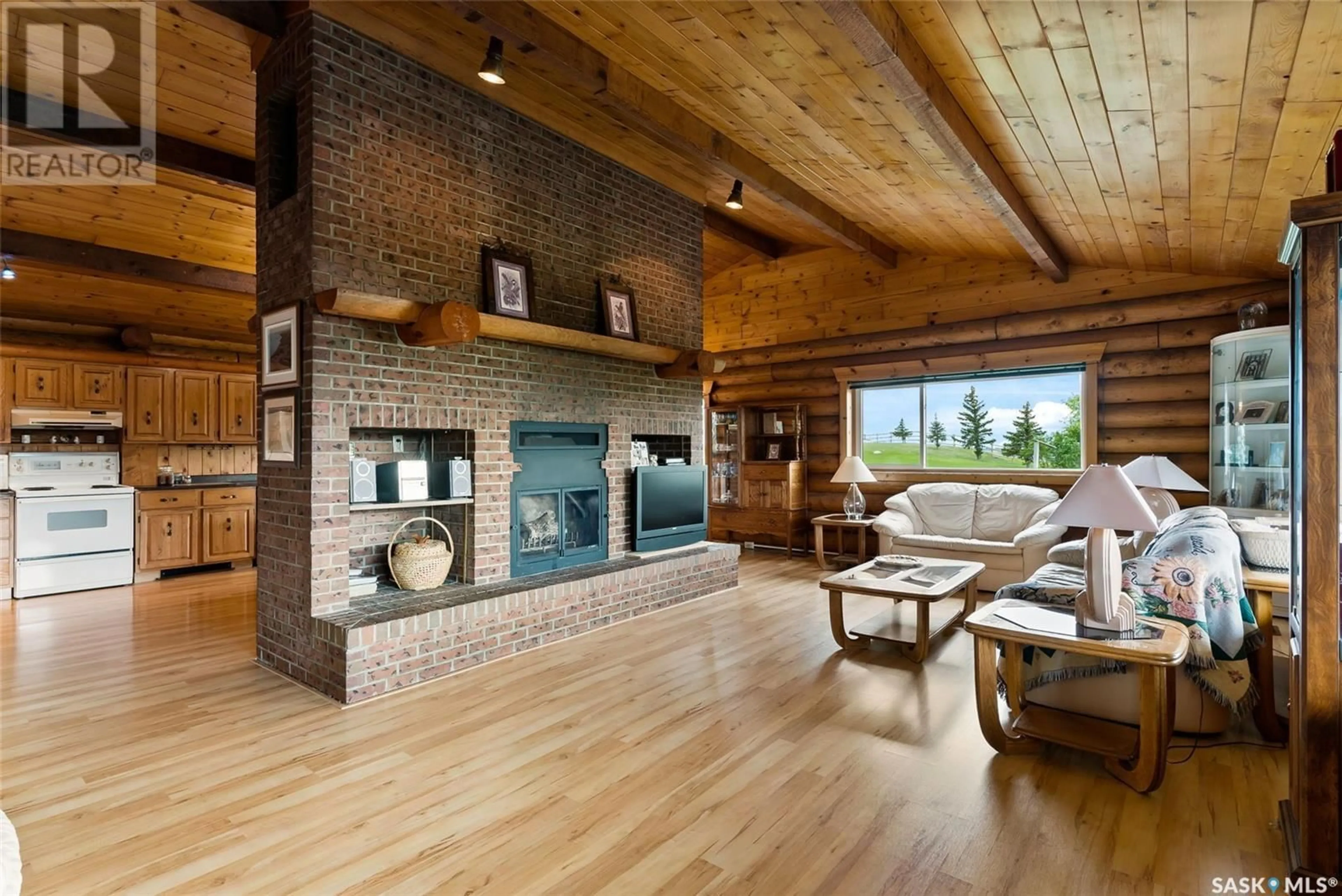 Living room with furniture, wood/laminate floor for Last Mountain Lake - BIG BROWN BARN, Longlaketon Rm No. 219 Saskatchewan S0G0W0