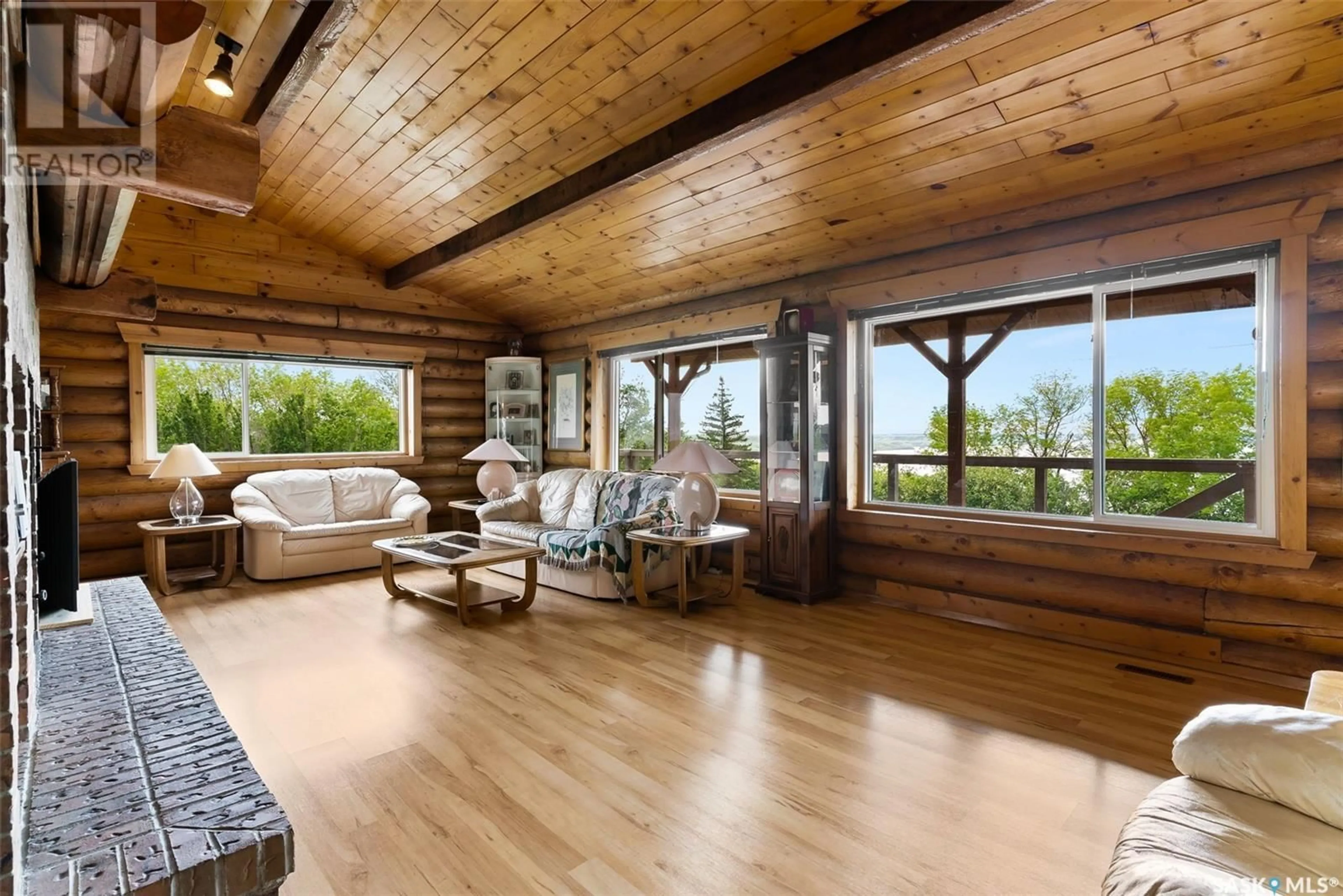 Living room with furniture, wood/laminate floor for Last Mountain Lake - BIG BROWN BARN, Longlaketon Rm No. 219 Saskatchewan S0G0W0