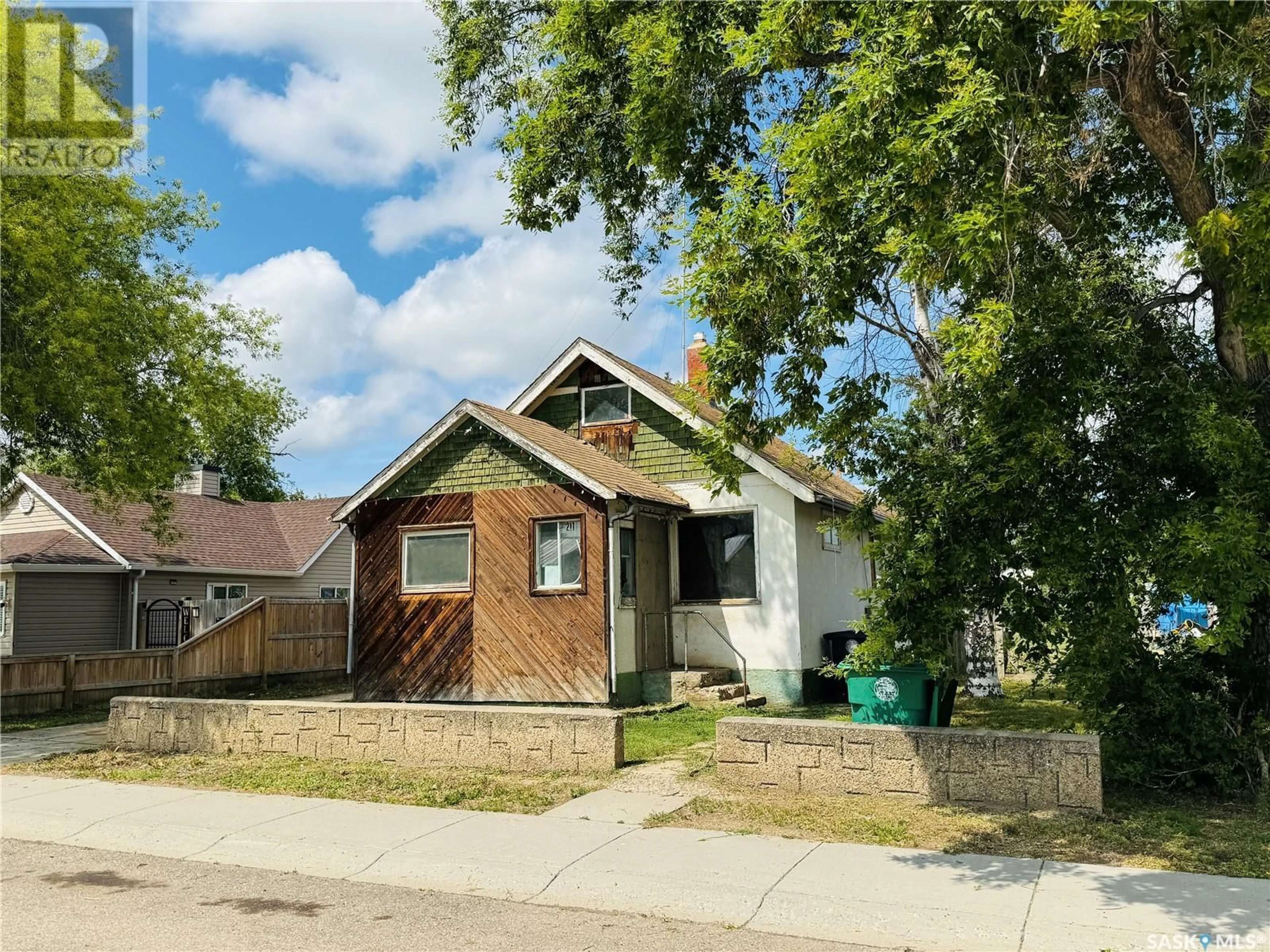 Home with brick exterior material, street for 211 4TH AVENUE, Biggar Saskatchewan S0K0M0