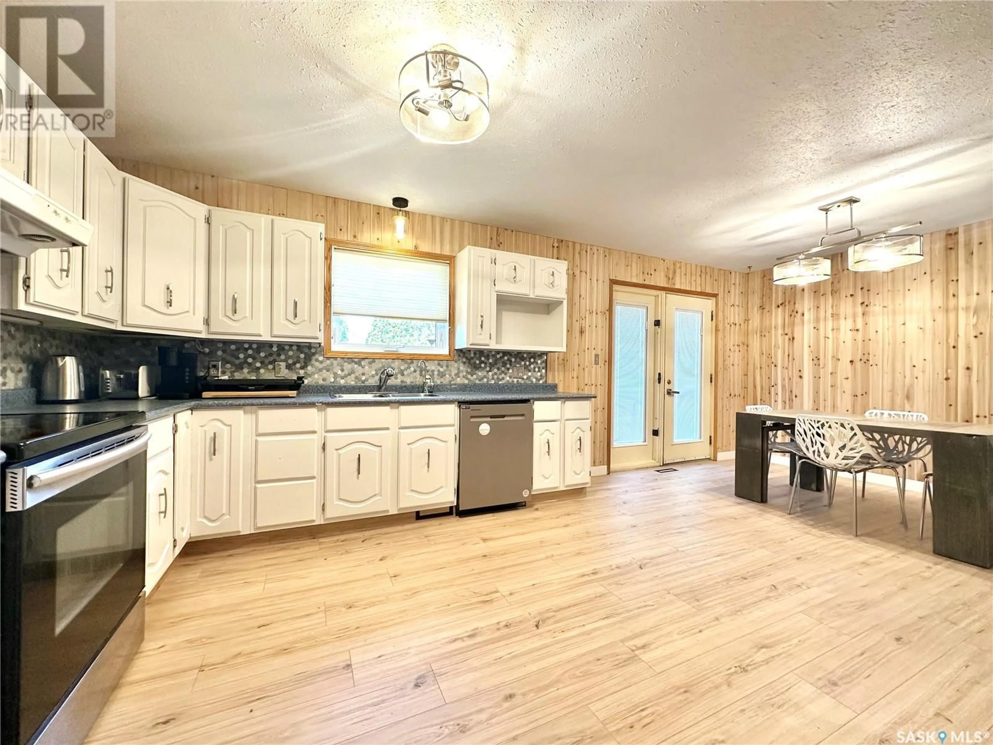 Open concept kitchen, wood/laminate floor for 2503 CARDINAL CRESCENT, North Battleford Saskatchewan S9A3X2