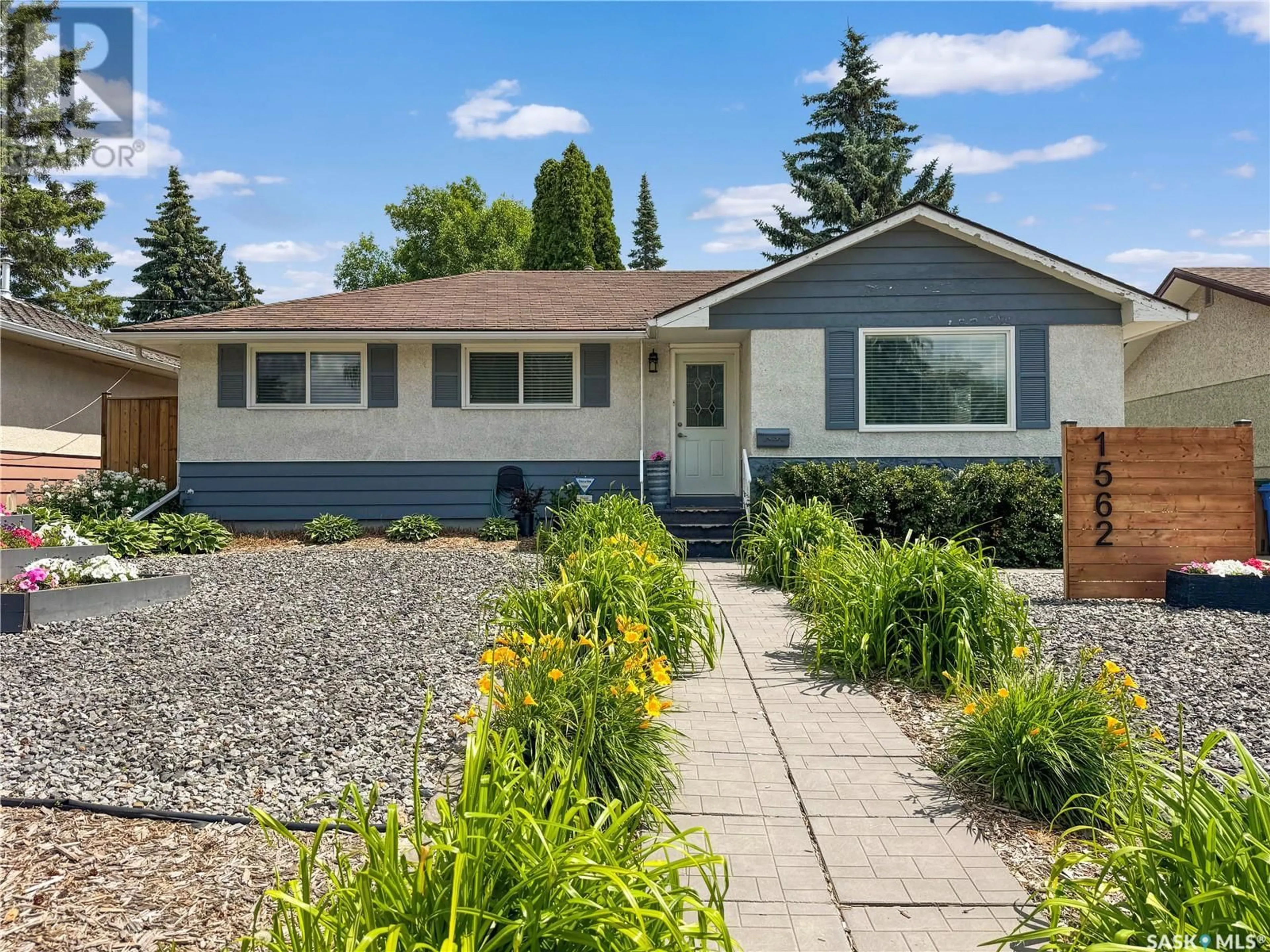 Home with vinyl exterior material, street for 1562 91ST STREET, North Battleford Saskatchewan S9A0A1