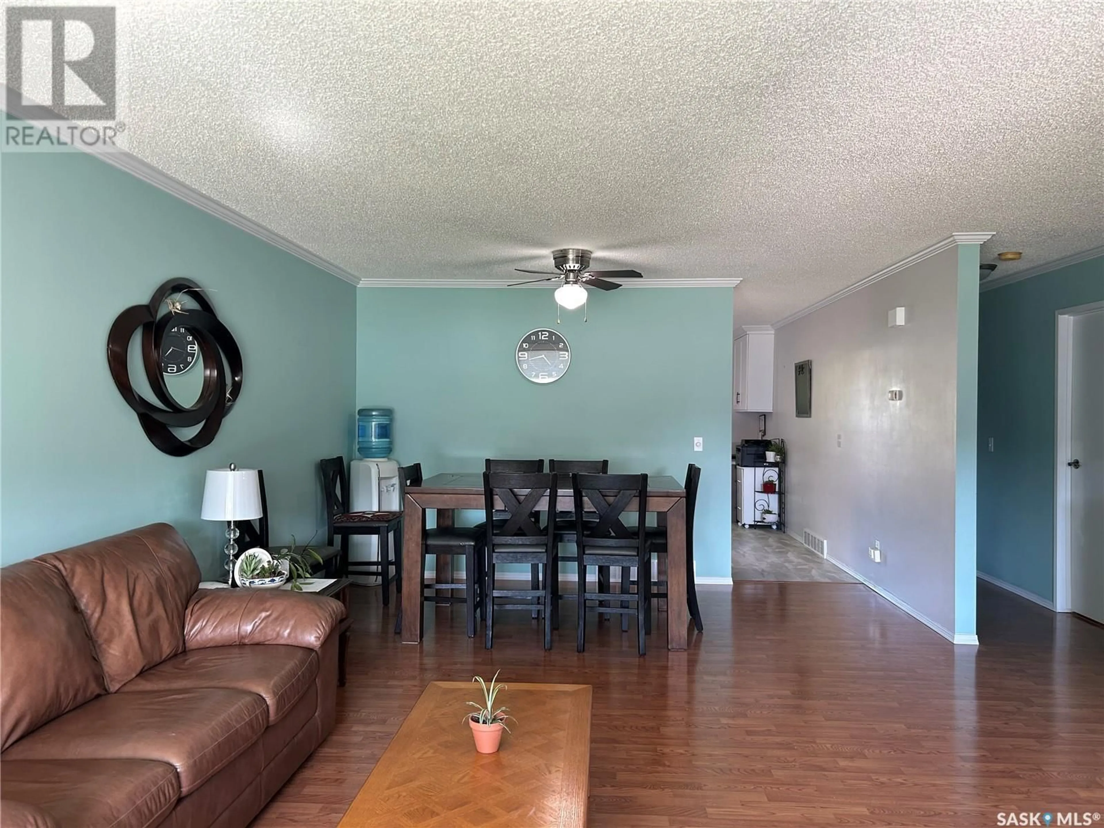 Living room with furniture, wood/laminate floor for 610 5TH STREET, Humboldt Saskatchewan S0K2A0